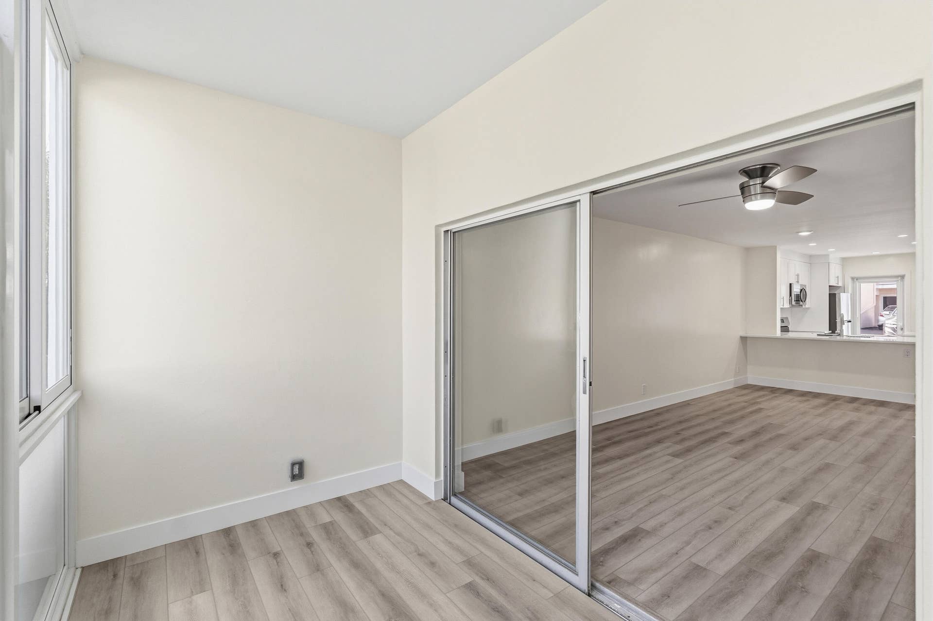 IMPACT GLASS ENCLOSED PATIO WITH DIRECT ACCESS TO COURTYARD POOL, BBQ AREA, SHUFFLEBOARD, AND CANAL BREEZEWAY.