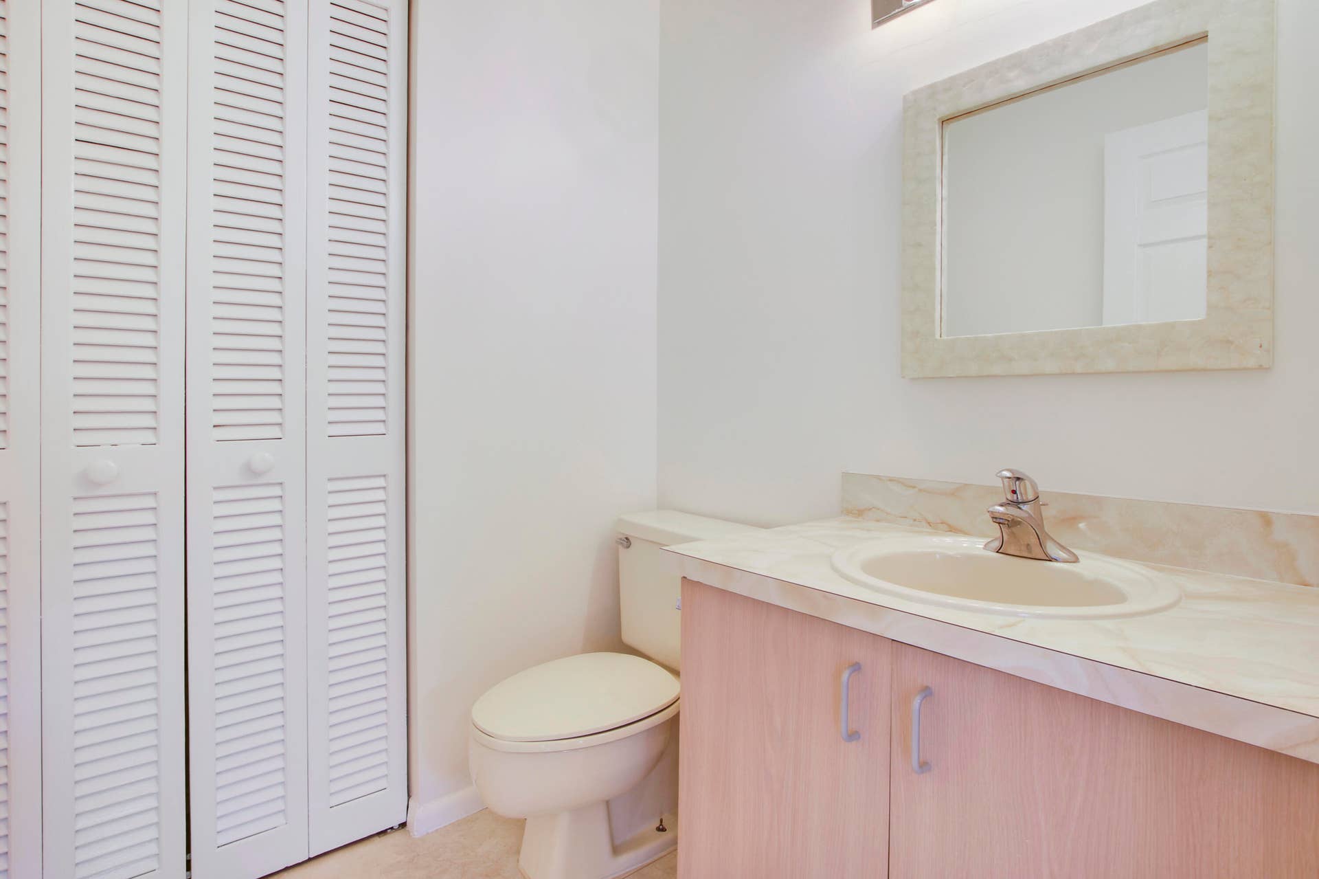 326 Jupiter Lakes Boulevard, #2318d, Jupiter, FL 33458 The unit offers a half bath with storage closet on the first floor.