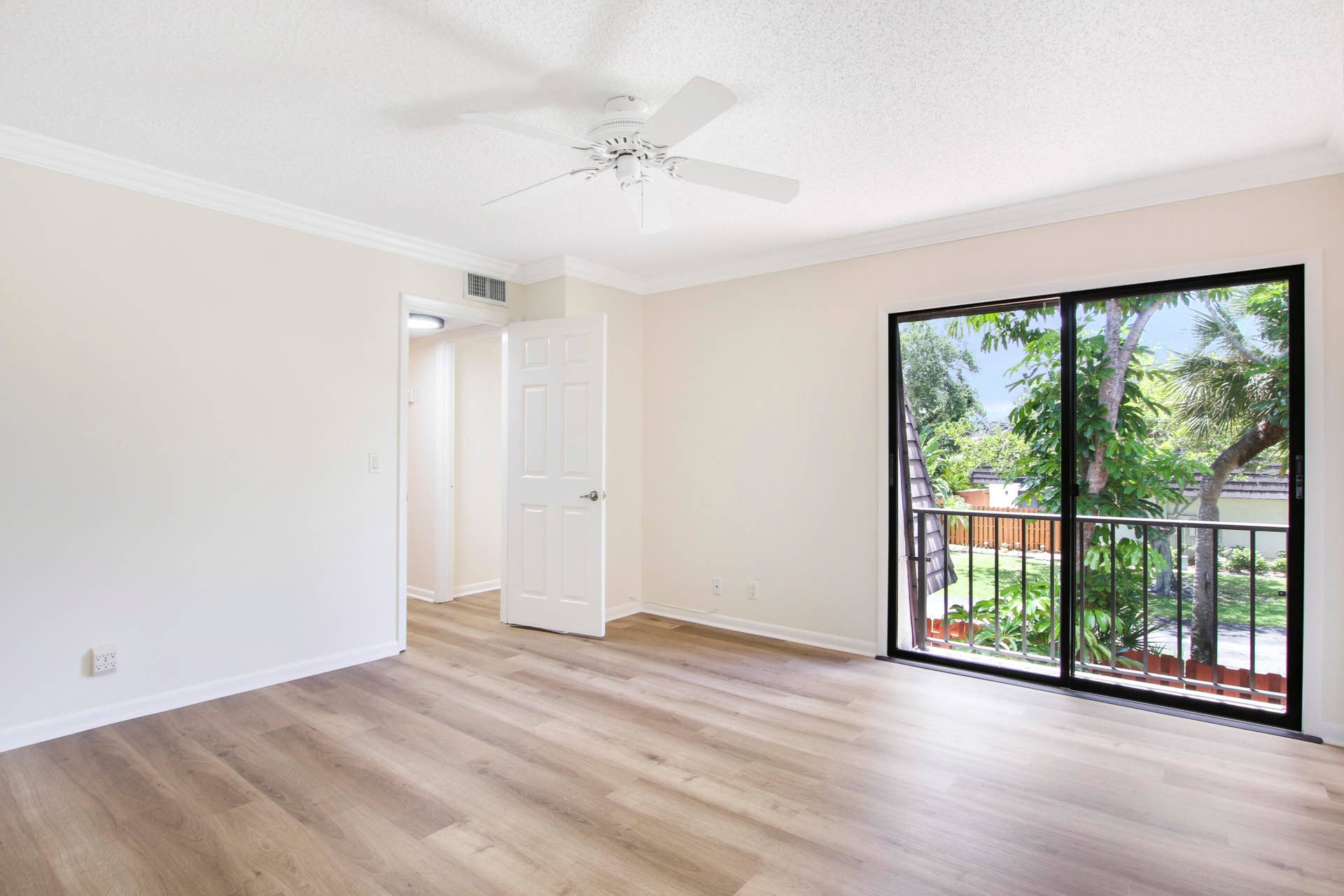 326 Jupiter Lakes Boulevard, #2318d, Jupiter, FL 33458 Luxury vinyl flooring covers the stairs and both bedrooms and sliding glass doors overlook the patio.