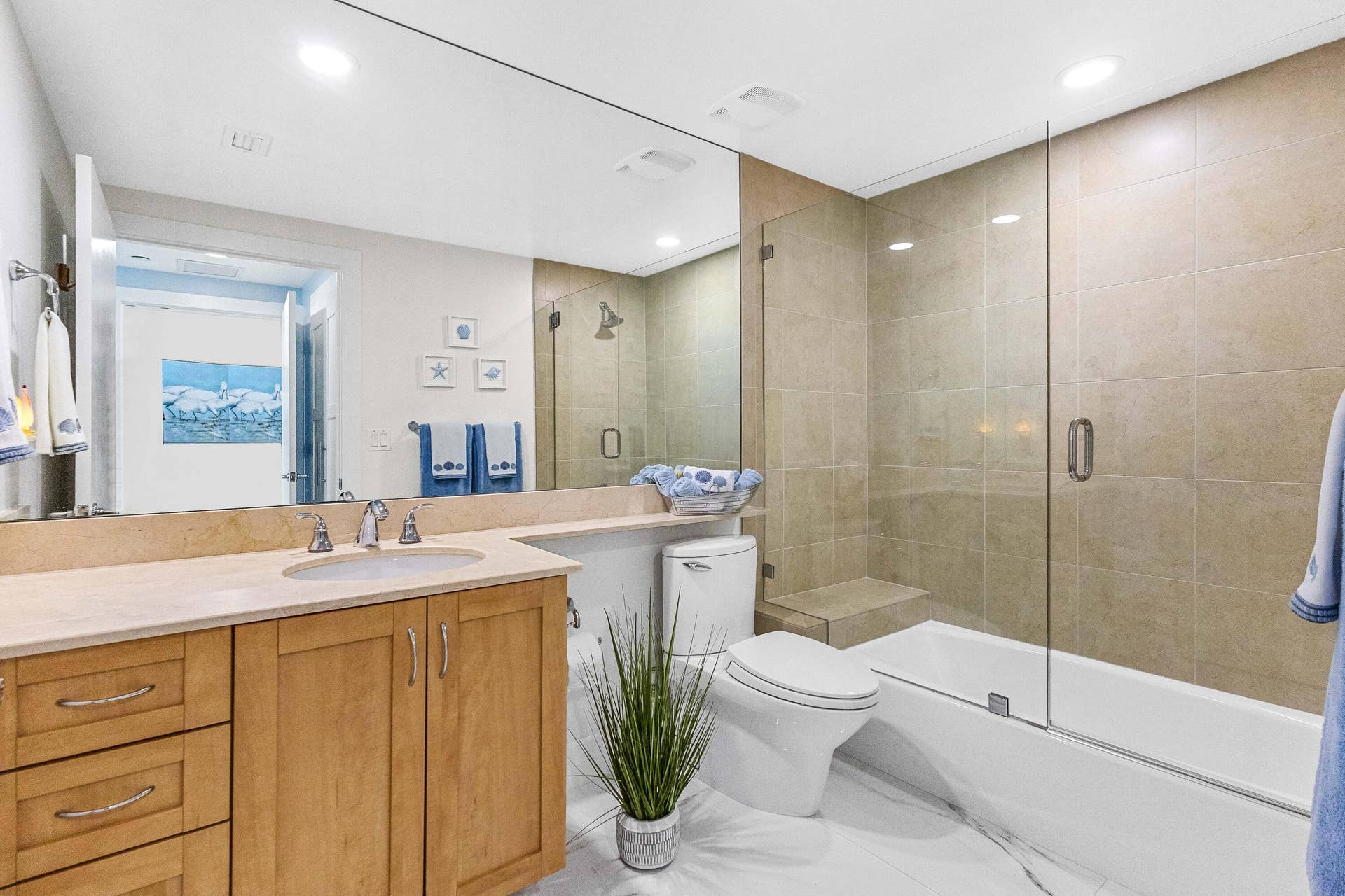 bathroom in suite to bedroom with tub shower combo