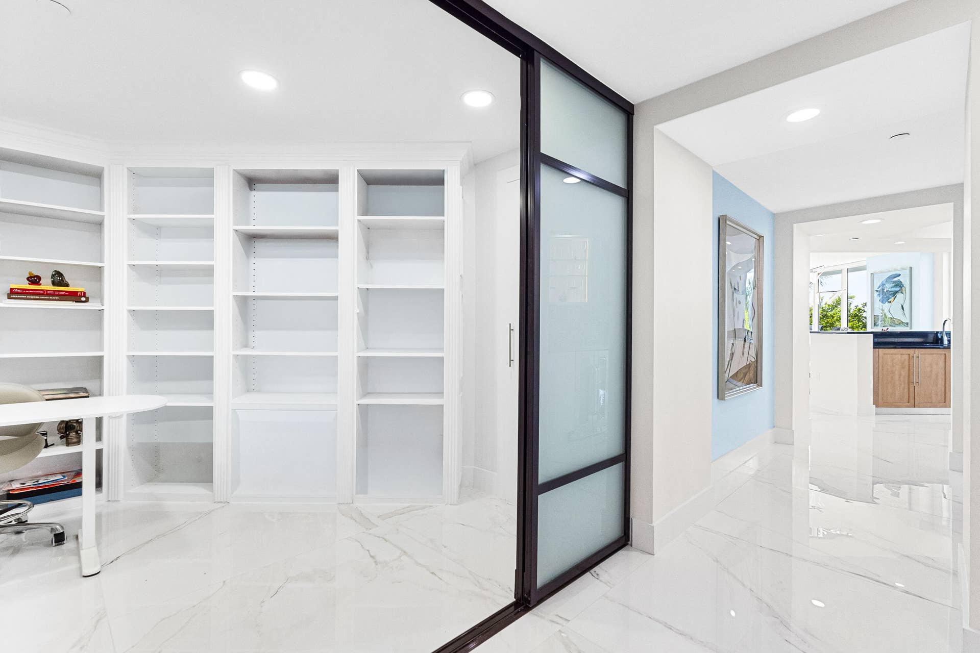 in addition to the 3 bedrooms a BONUS space the den to be used as a movie room, art studio, office with built in shelves.