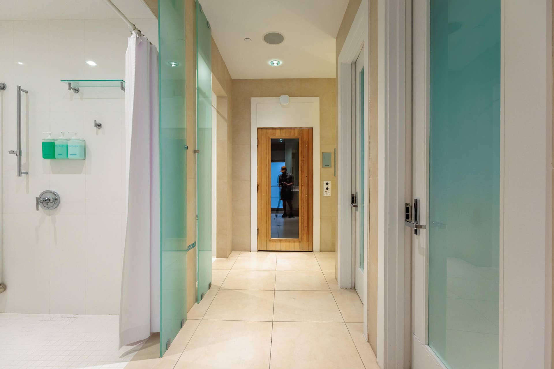 his and her shower, bathrooms, sauna, and steam room.