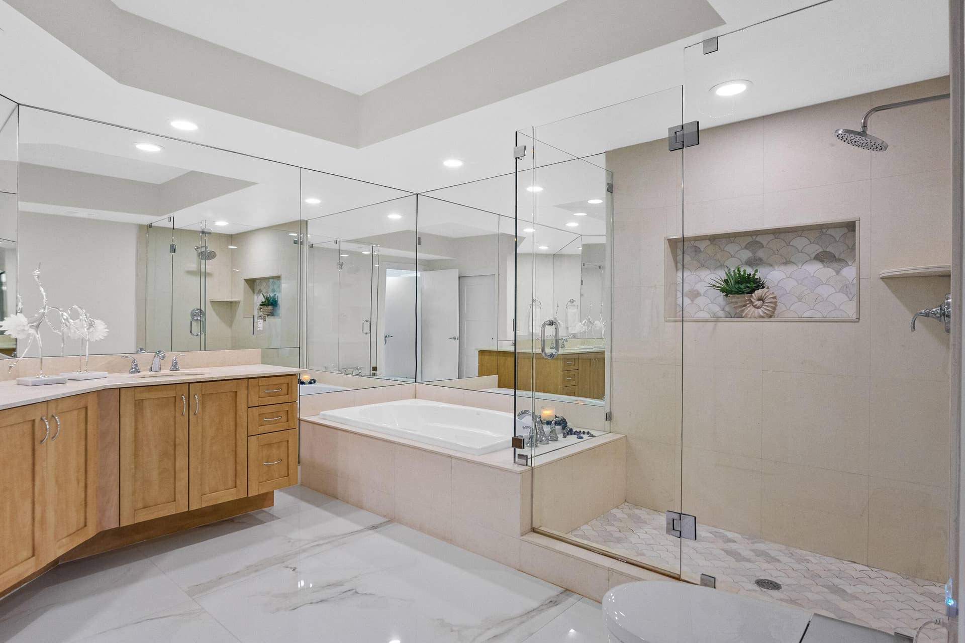 stand up shower, updated with tile flooring, soaking tub, and double sinks.