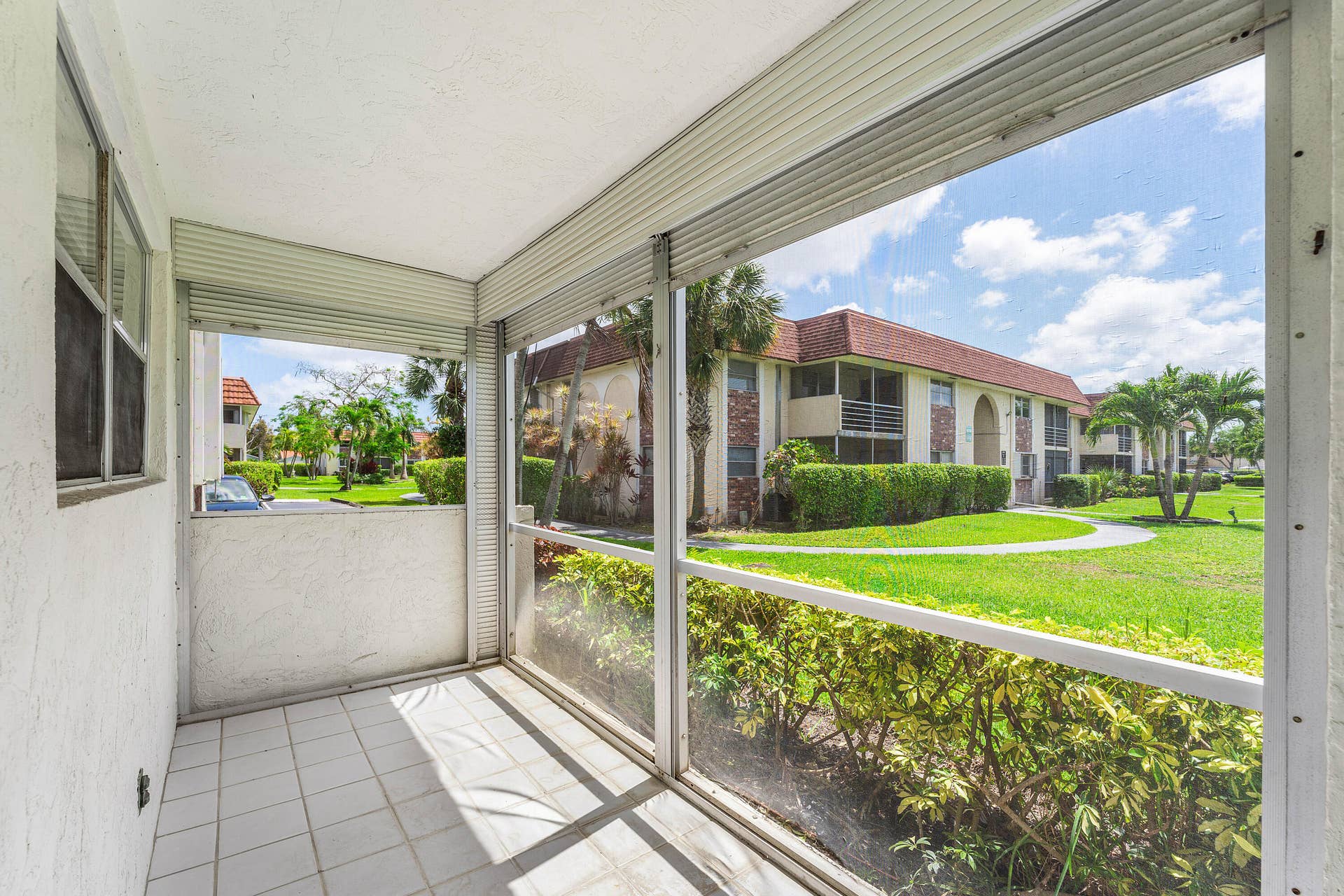 22725 SW 66th Avenue SW, #103, Boca Raton, FL 33428 Living Area Natural Light & Patio Acce