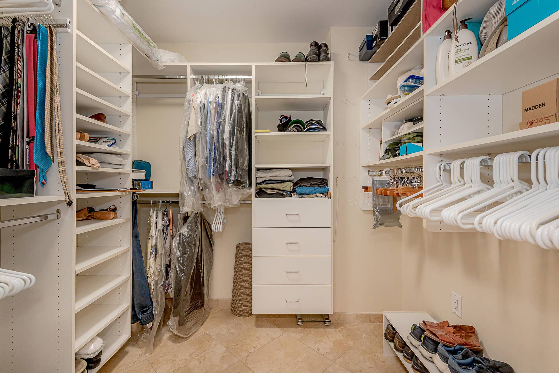 PRIMARY BEDROOM WALK IN CUSTOM CLOSET