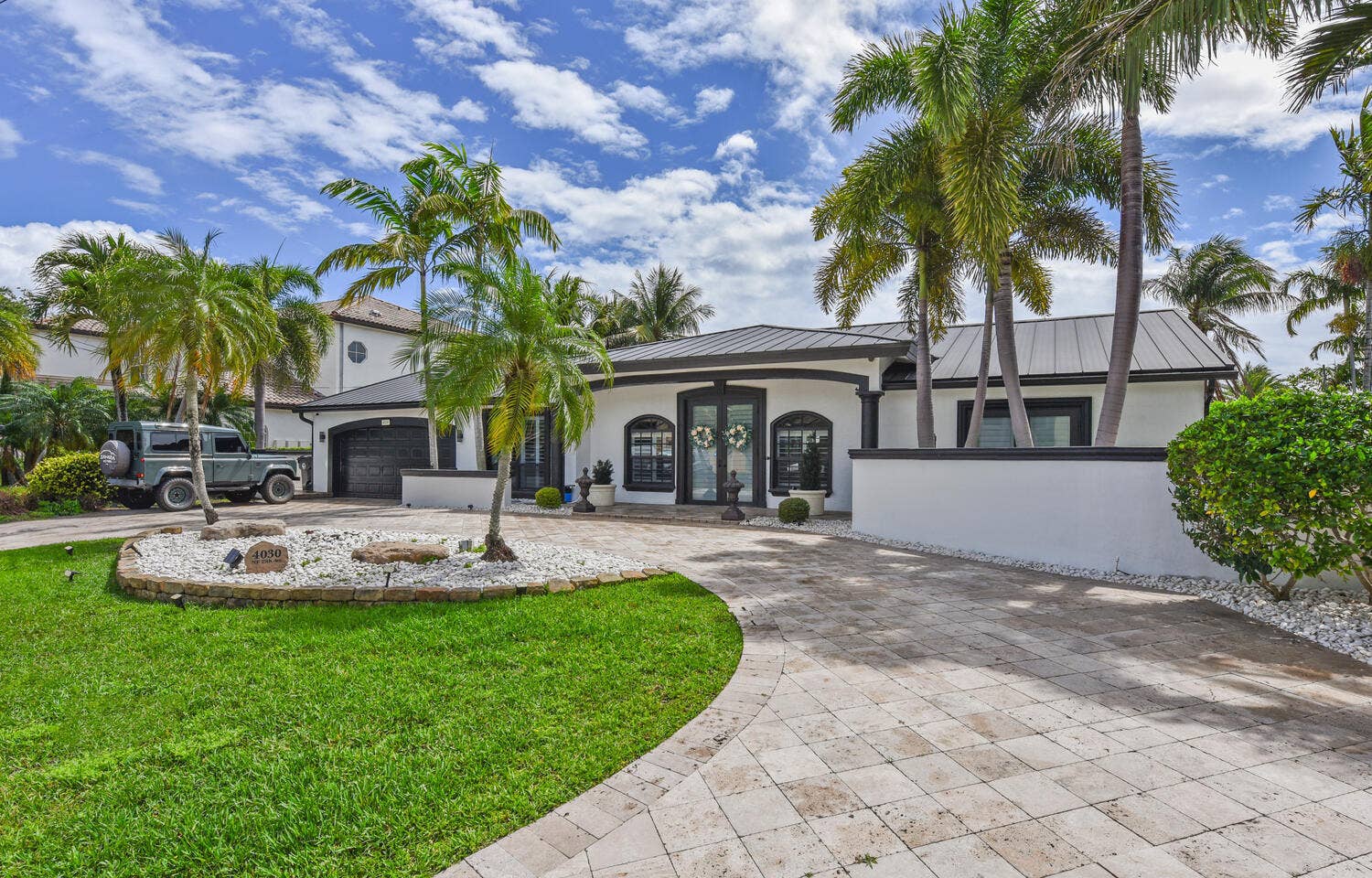 4030 NE 25th Avenue, Lighthouse Point, FL 33064 Gorgeous renovated deepwater home features metal roof, impact windows and customs upgrades throughout
