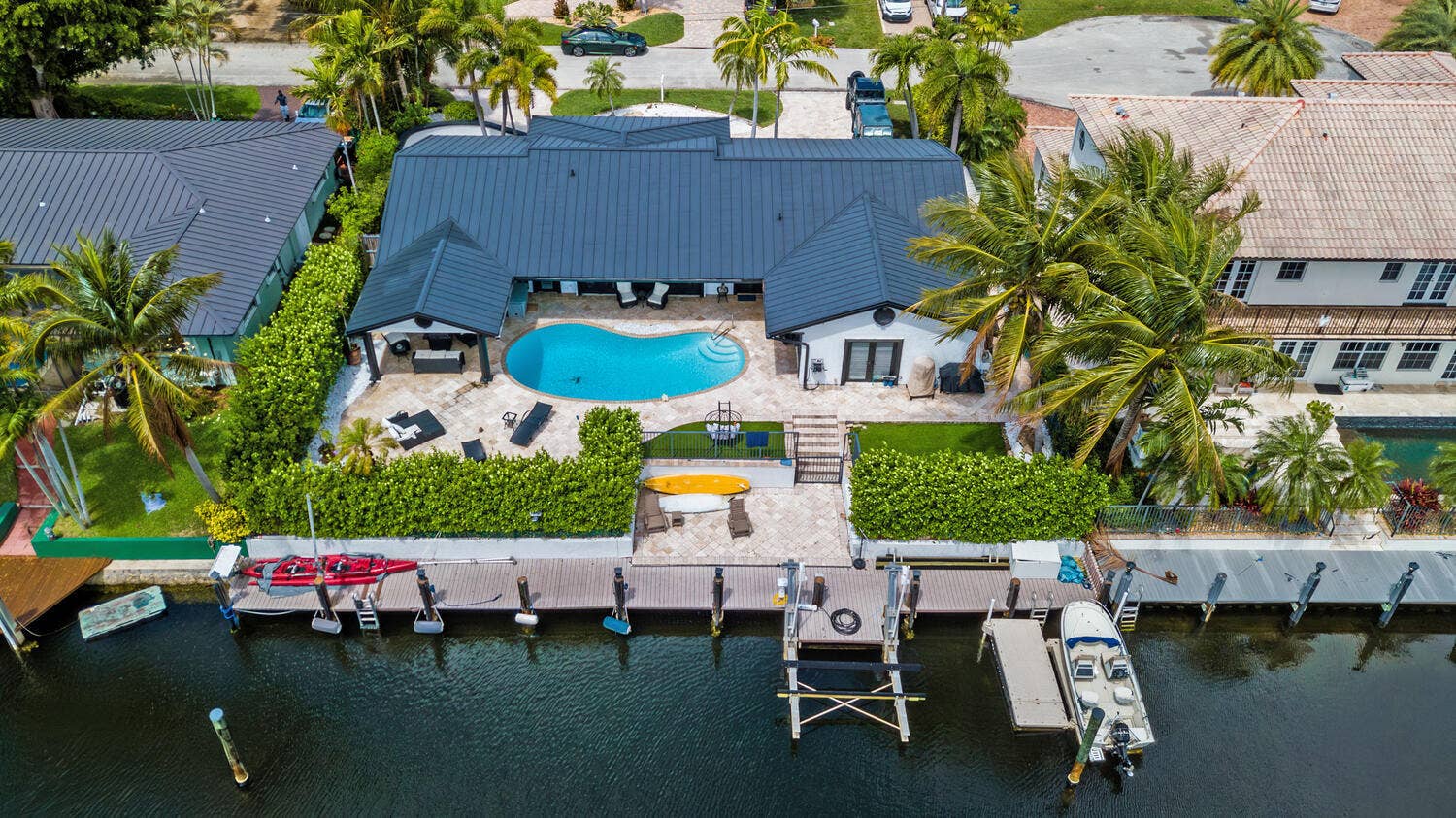 4030 NE 25th Avenue, Lighthouse Point, FL 33064 Gorgeous renovated deepwater home features metal roof, impact windows and customs upgrades throughout