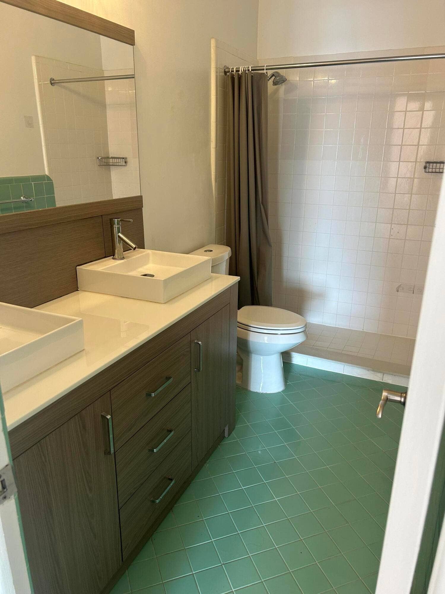 Hall Bath with dual sinks and shower.