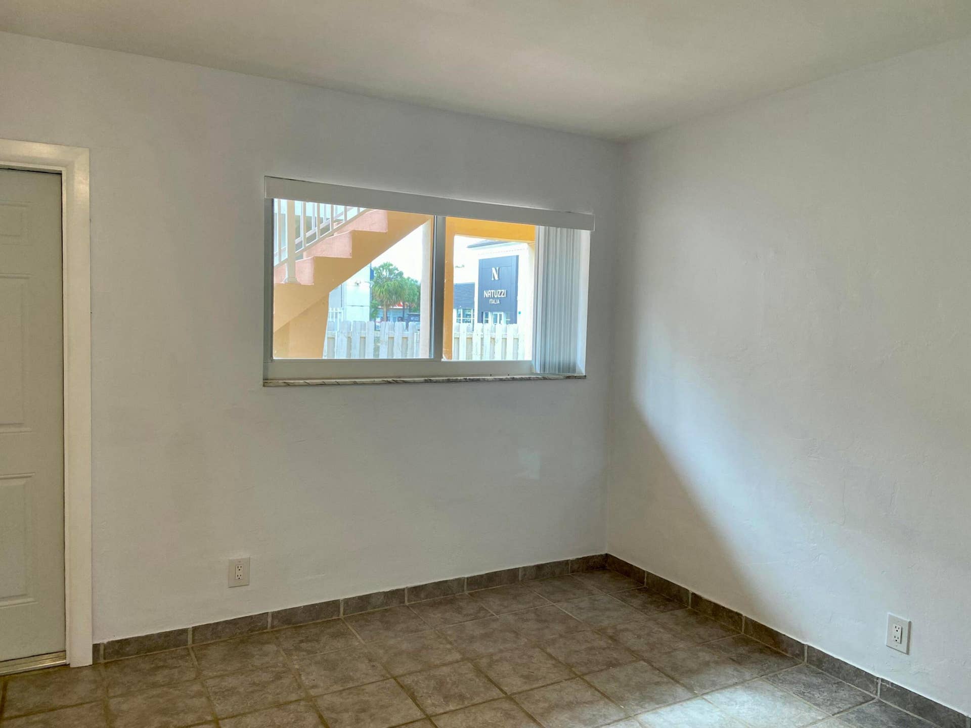 2909 Middle River Drive, #105, Fort Lauderdale, FL 33306 Bedroom with door to Pool, BBQ & Laundry
