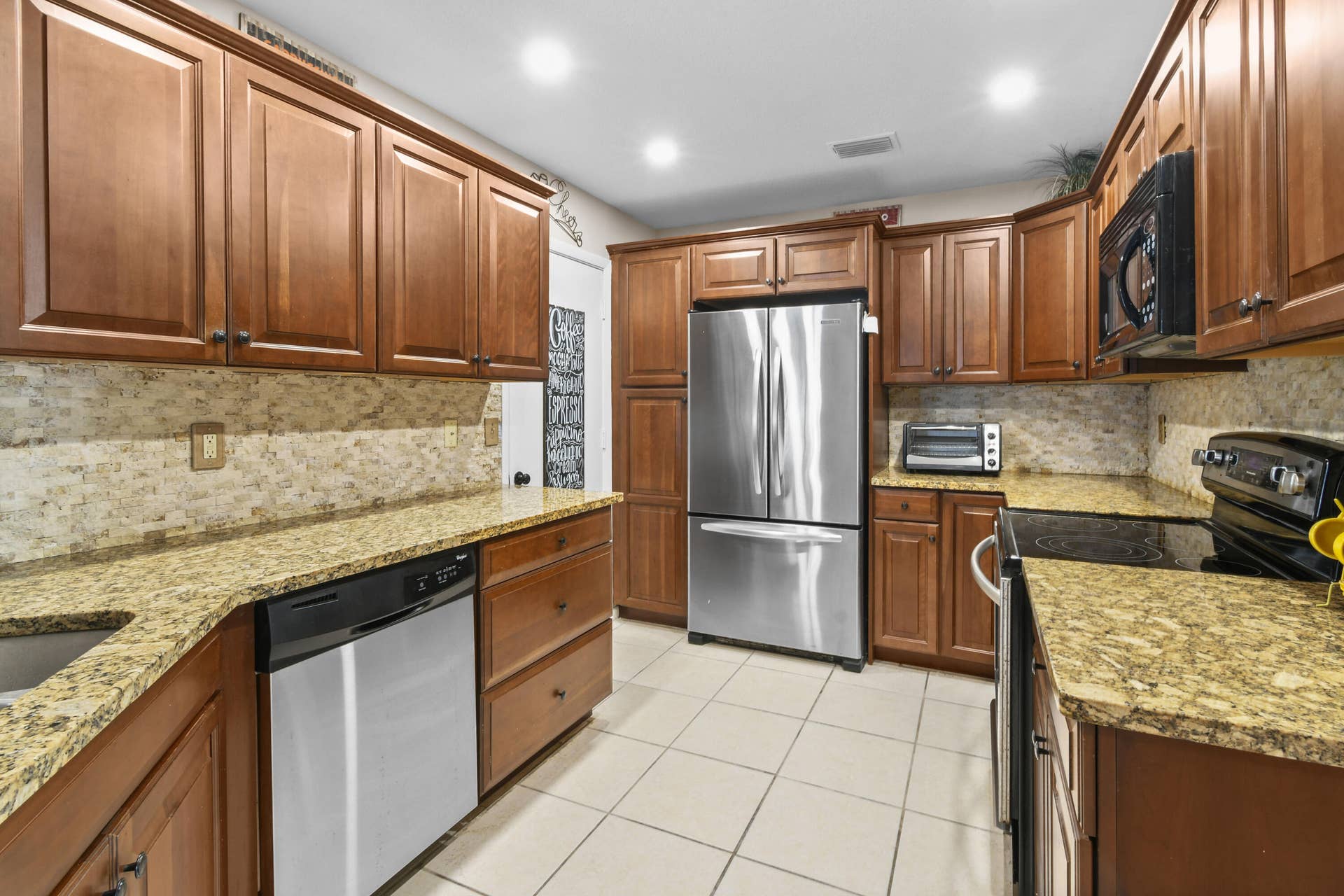 1003 Ocean Dunes Circle, Jupiter, Jupiter, FL 33477 Kitchen with stainless steel appliances. New lighting
