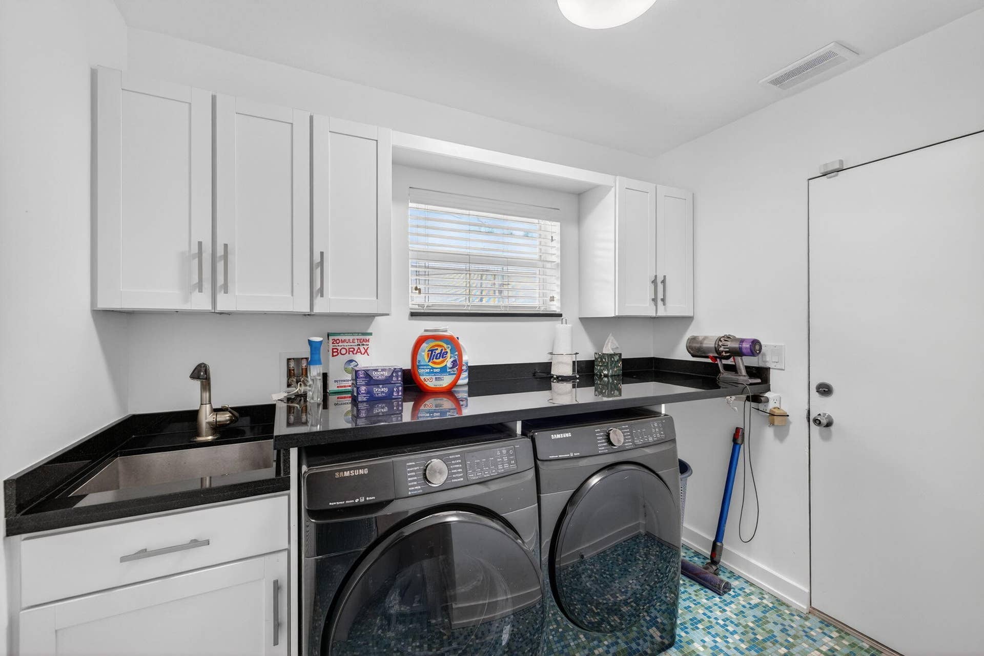 Large Laundry Room Leads to Garage