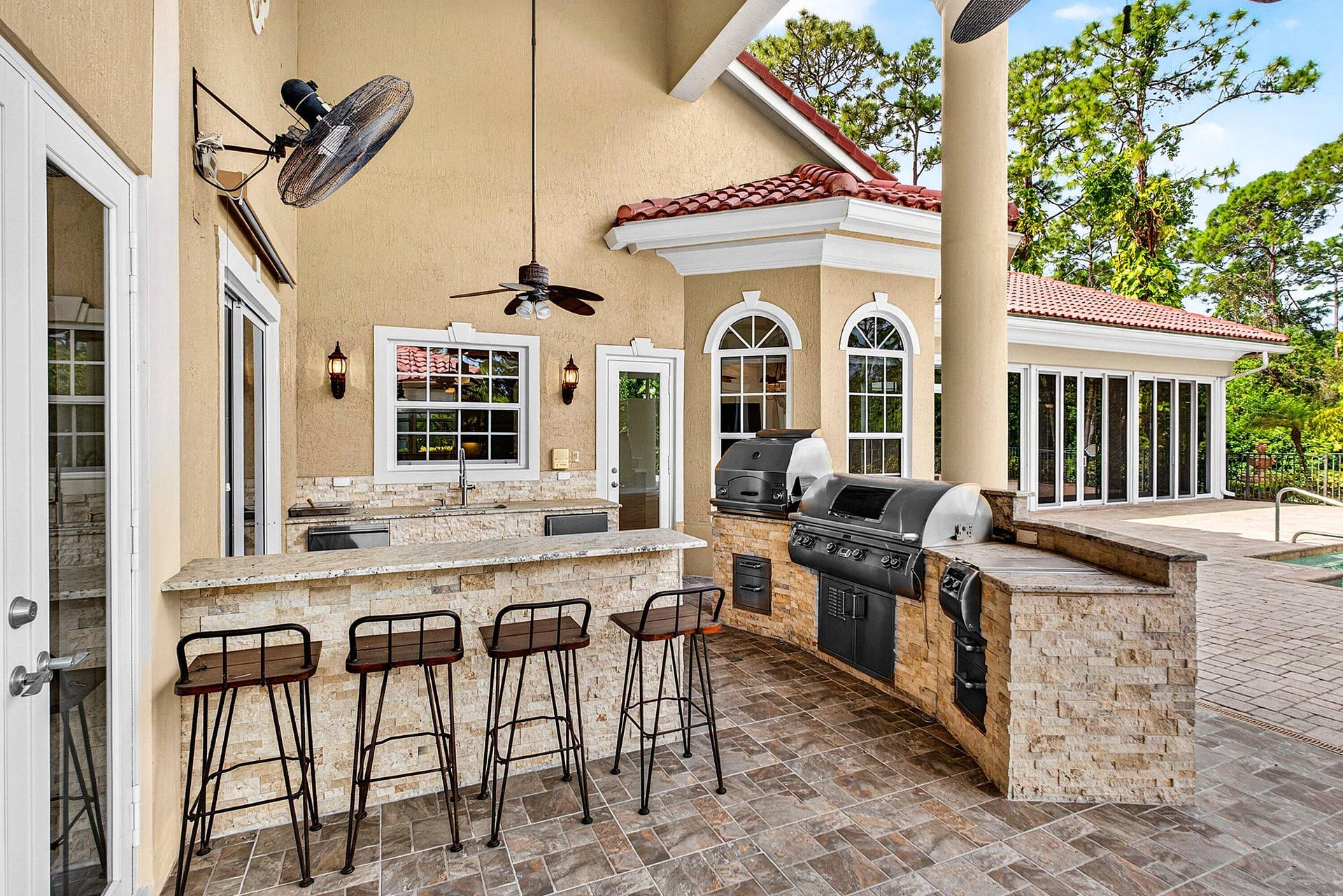 6071 NW 69th Way, Parkland, FL 33067 Summer kitchen with pizza oven