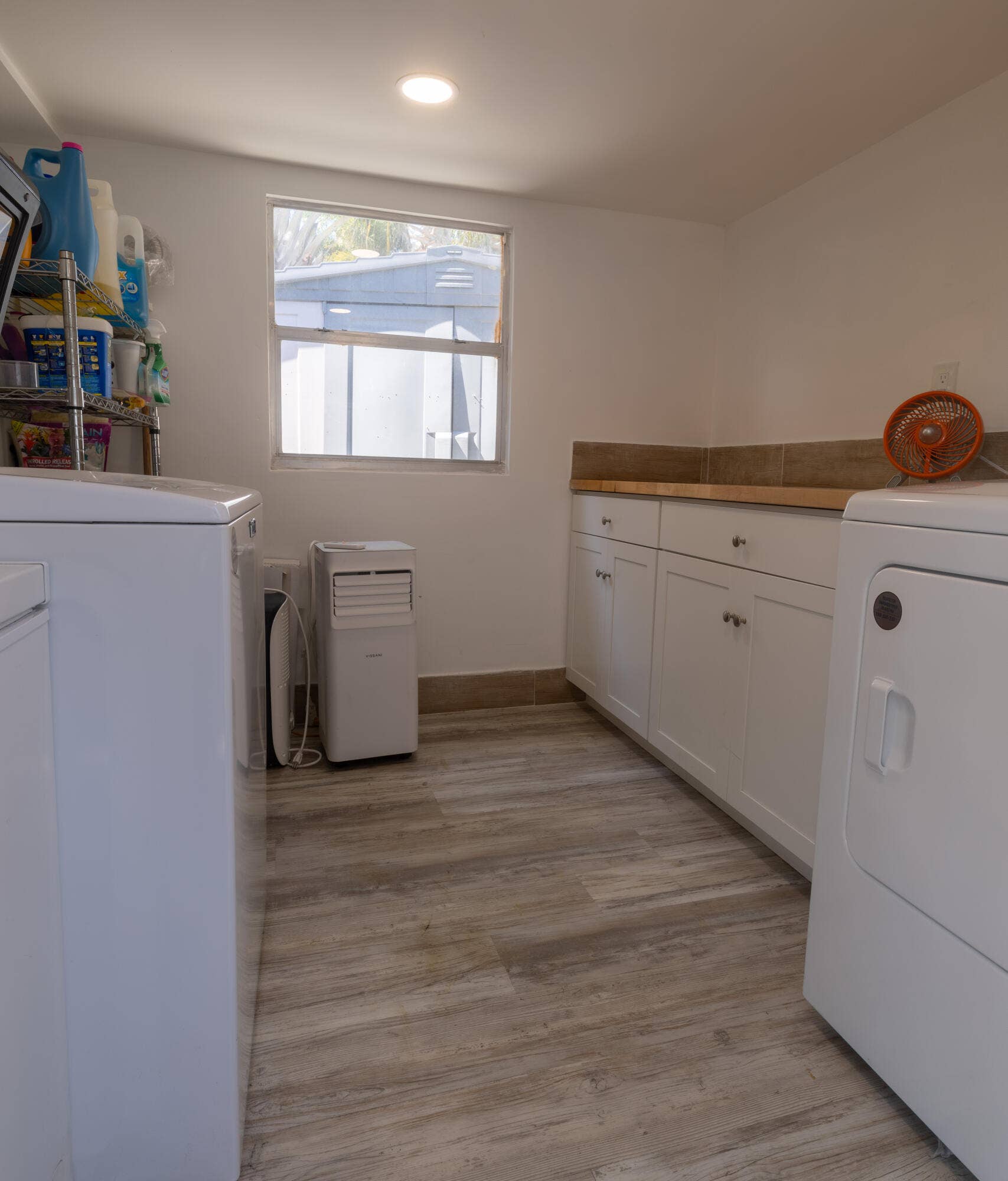 2800 NE 1st Avenue, Wilton Manors, FL 33334 Laundry Room with Washer and Dryer, working counter top and storage