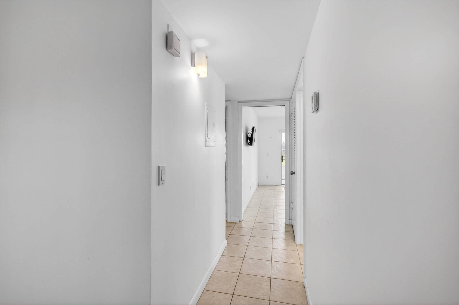 167 Normandy, #D, Delray Beach, FL 33484 Tiled Hallway leading to Baths and Bedrooms