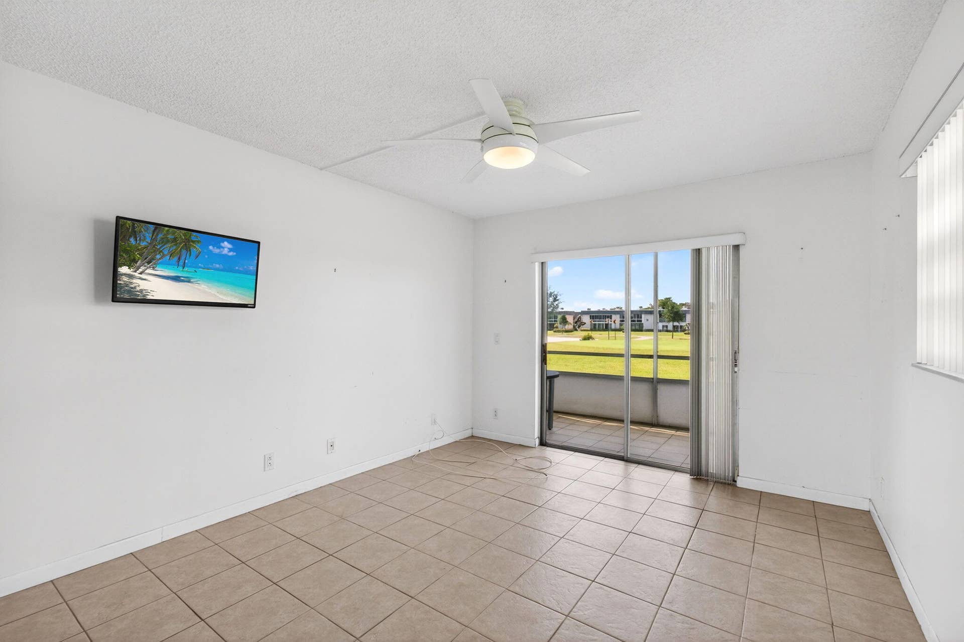 167 Normandy, #D, Delray Beach, FL 33484 Golf Views and Mounted TV in fully Tiled Bedroom with Patio Access