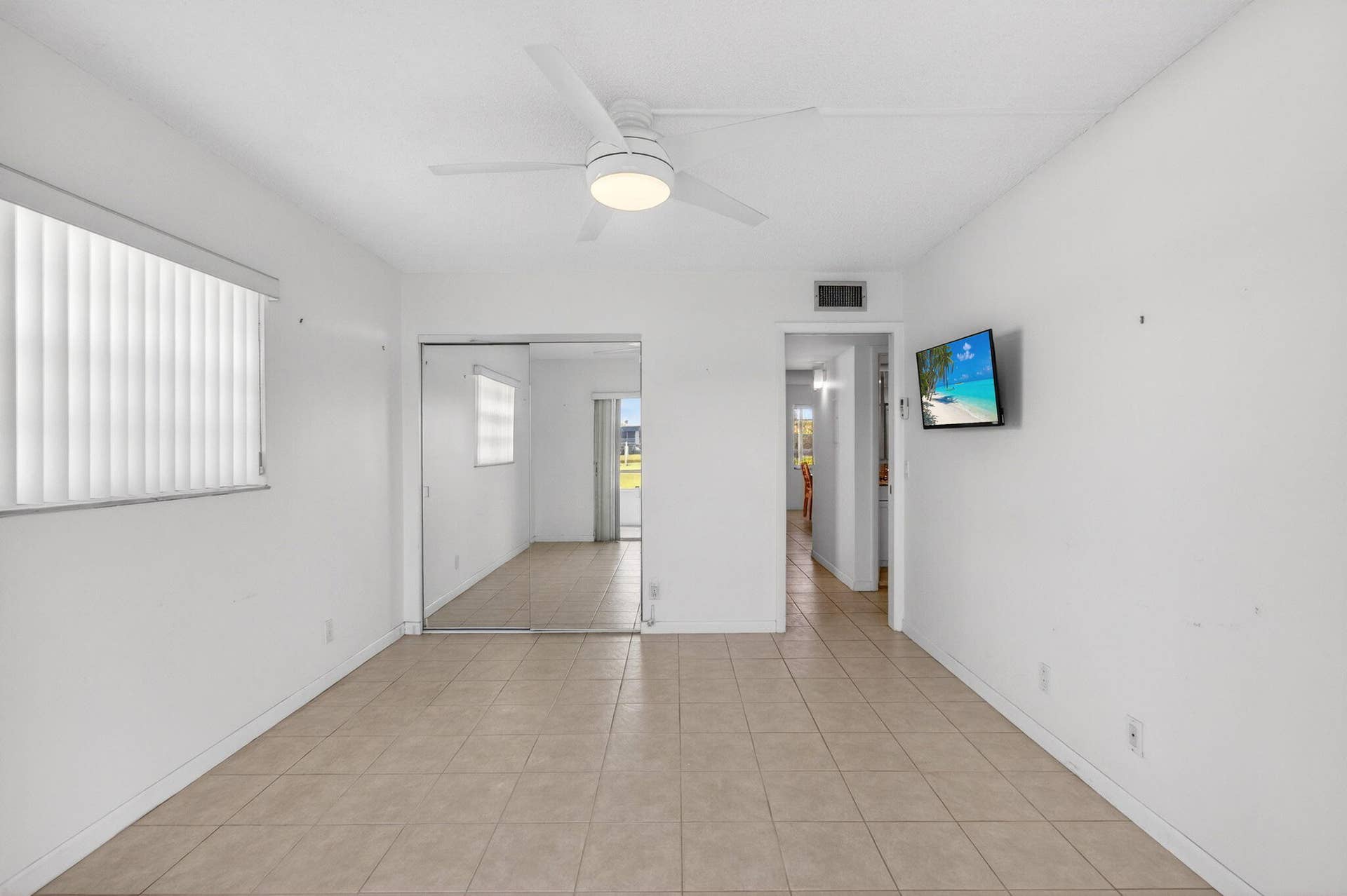 167 Normandy, #D, Delray Beach, FL 33484 Tiled Bedroom with Golf Views and Mounted TV
