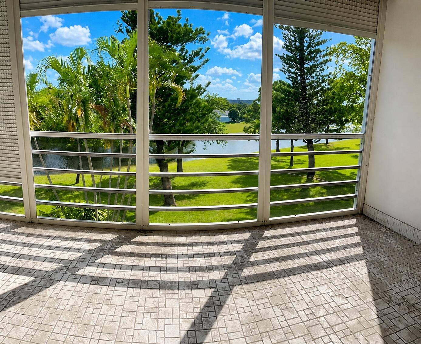 3010 N Course Drive, #312, Pompano Beach, FL 33069 Balconey Sunlit balcony view with lush l