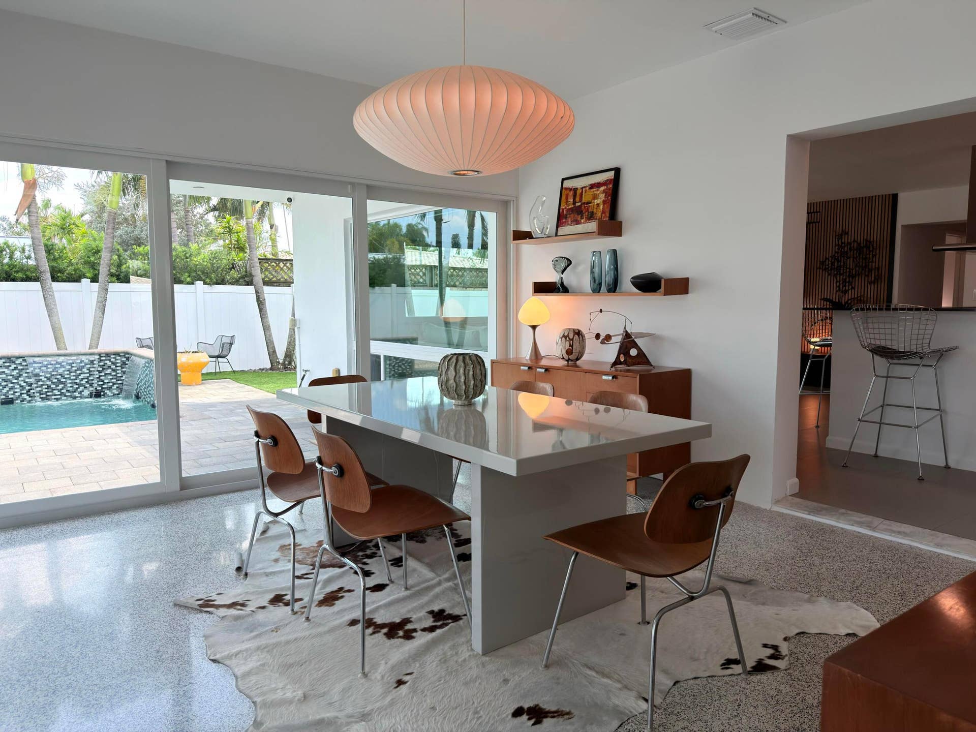 2222 NE 15th Court, Fort Lauderdale, FL 33304 Dining room surrounded by a wall of sliders