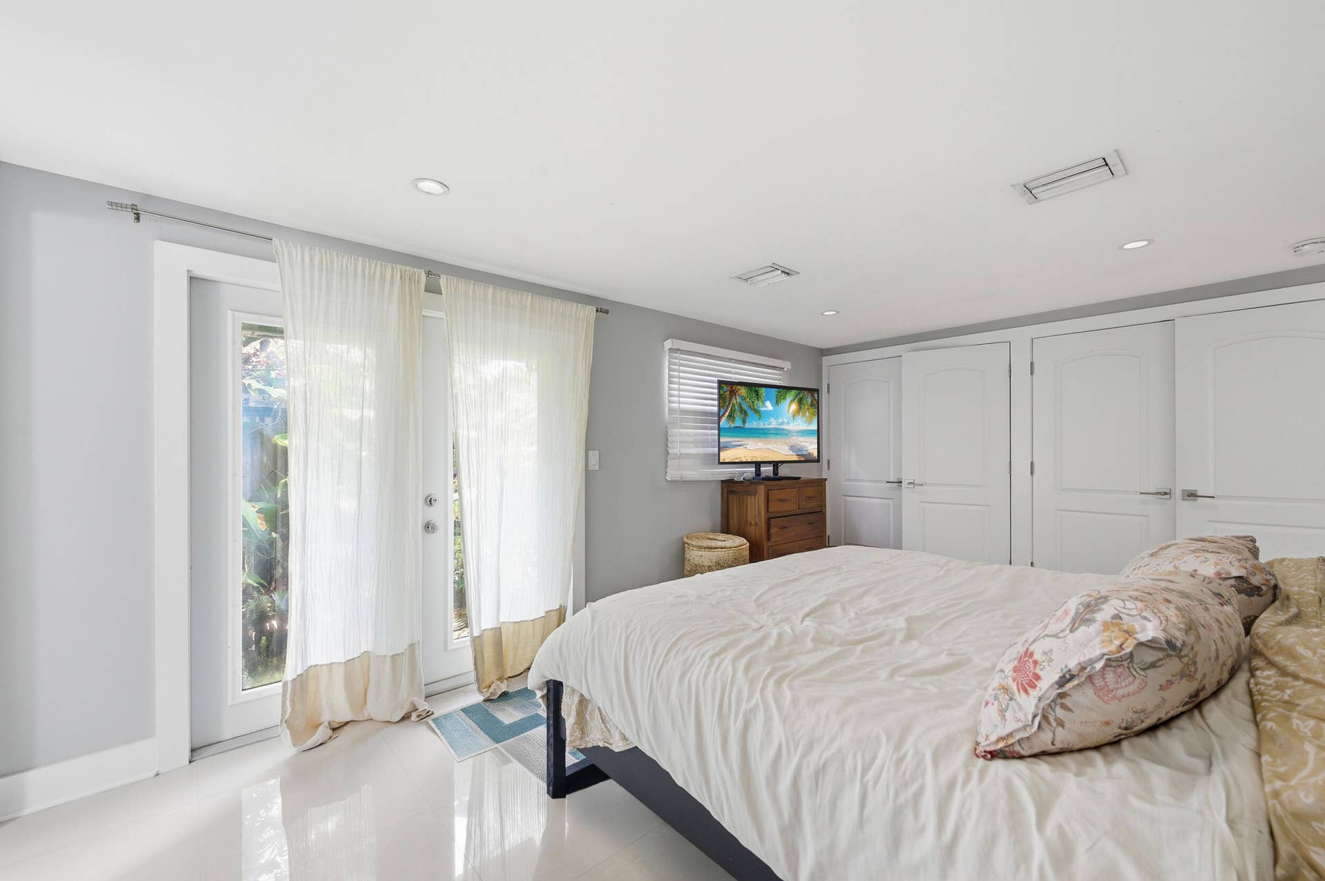 Primary Bedroom with French Doors Leading Out to Garden