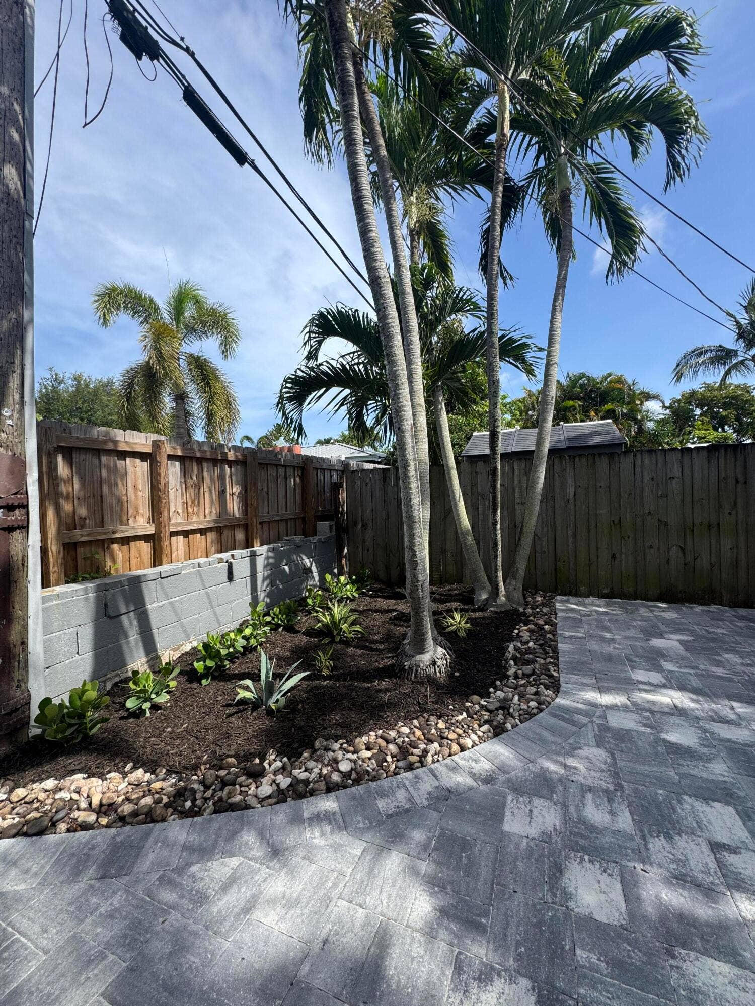 Private fenced in backyard; new pavers and landscaping