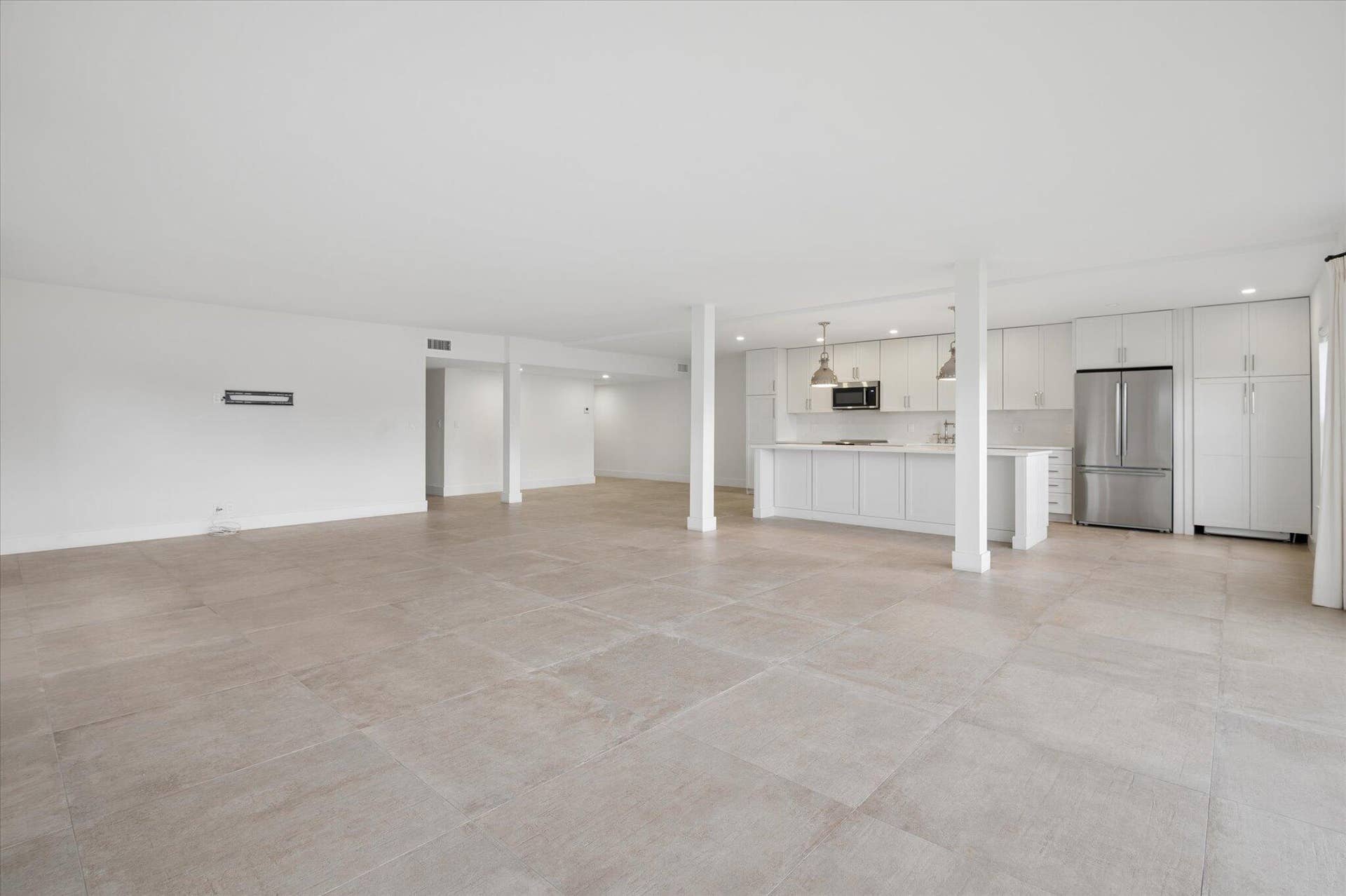 5100 Bayview Drive, #106, Fort Lauderdale, FL 33308 Airy corner-unit location showcasing seamless flow between, living, dining and kitchen spaces.
