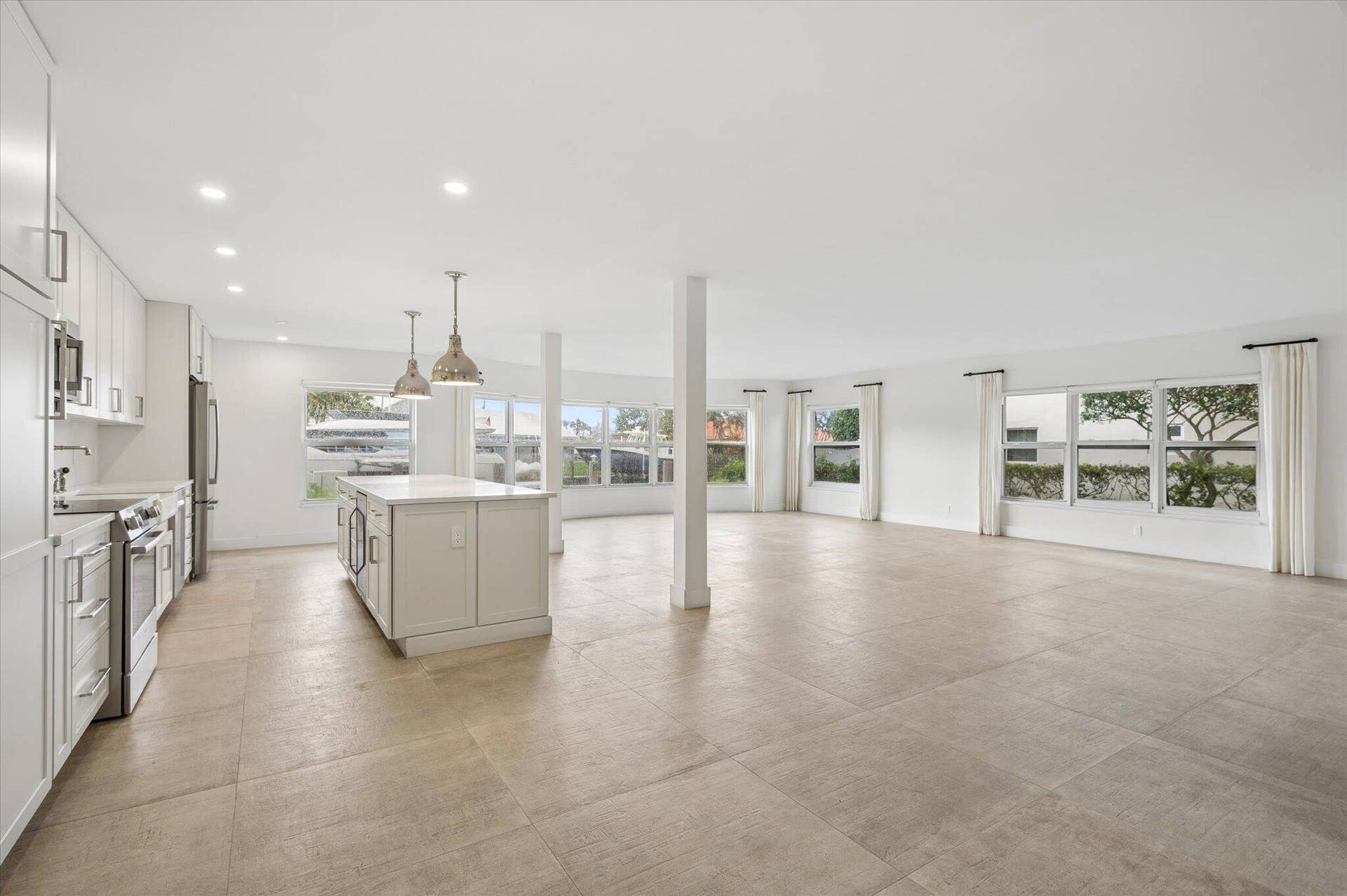 5100 Bayview Drive, #106, Fort Lauderdale, FL 33308 Generous open-concept layout with panoramic water views 1,835 sq ft of living space provides flexibility for multiple dining, entertaining, or work-from-home configurations.