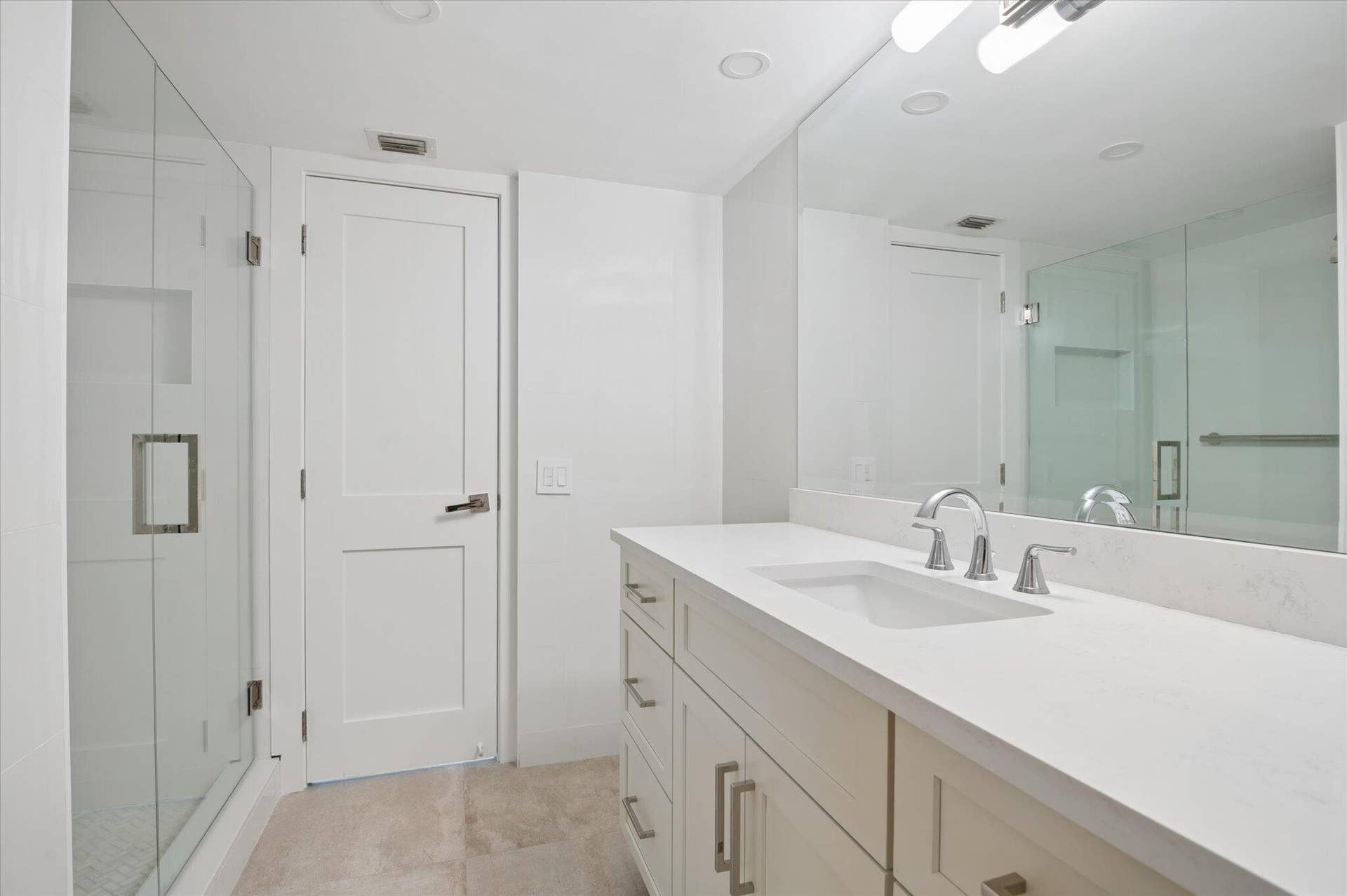 5100 Bayview Drive, #106, Fort Lauderdale, FL 33308 Full bath with glass-enclosed shower and clean, modern finishes.
