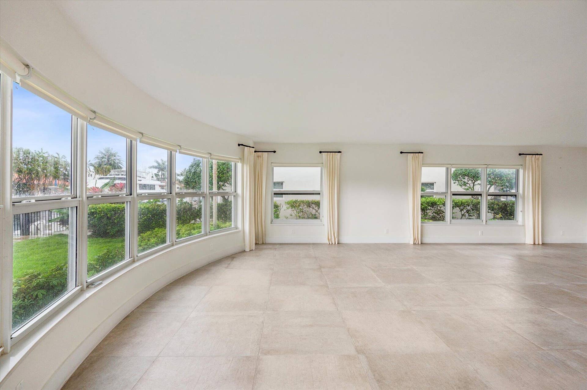 5100 Bayview Drive, #106, Fort Lauderdale, FL 33308 Bright CORNER exposure featuring complete IMPACT glass windows that flood the space with natural light while offering security and peace of mind.