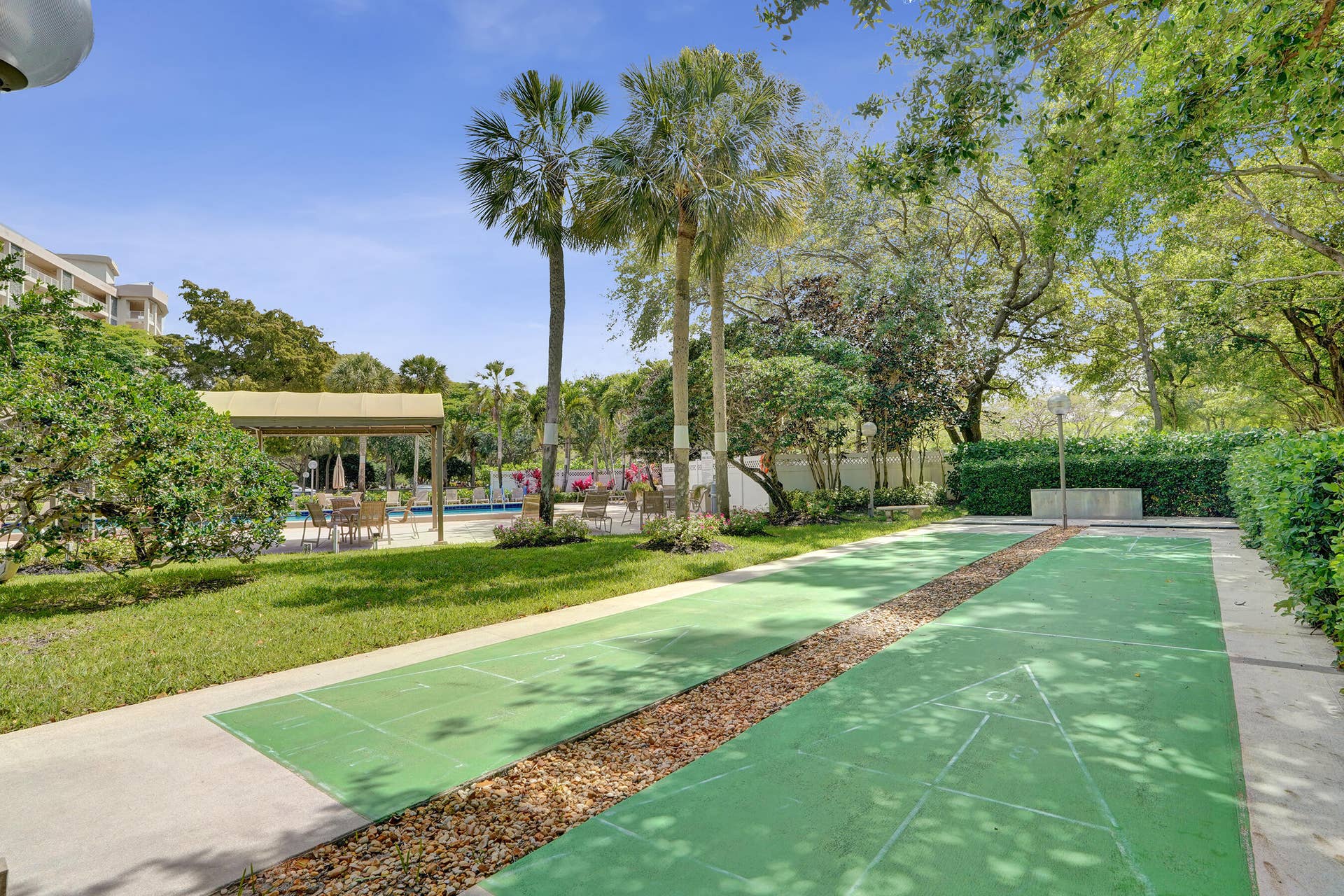 3499 Oaks Way, #Unit 205, Pompano Beach, FL 33069 Outdoor game area surrounded by lush gardens and grenery