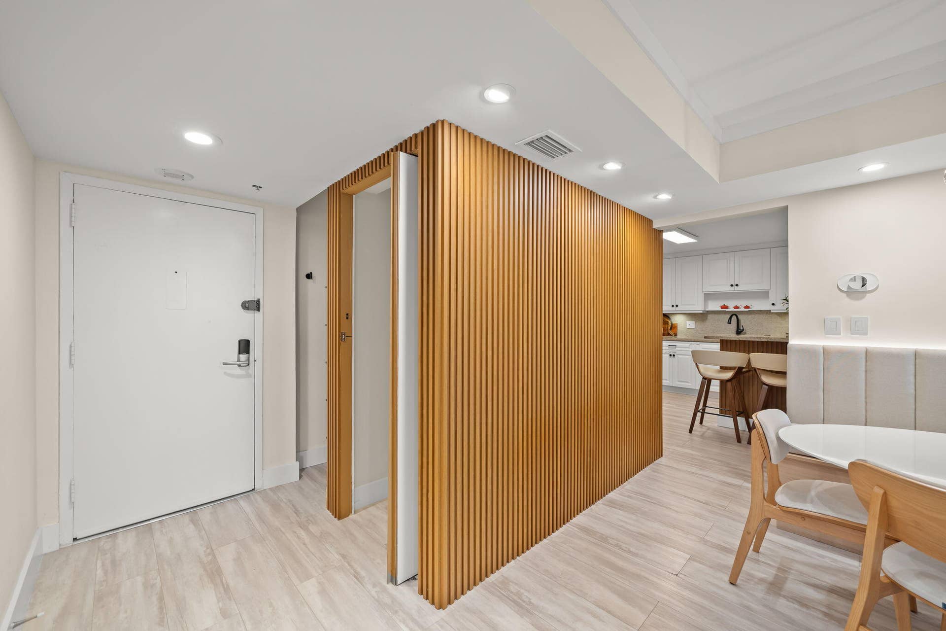 16300 Golf Club Road, Weston, FL 33326 door seamlessly wood-slatted paneling