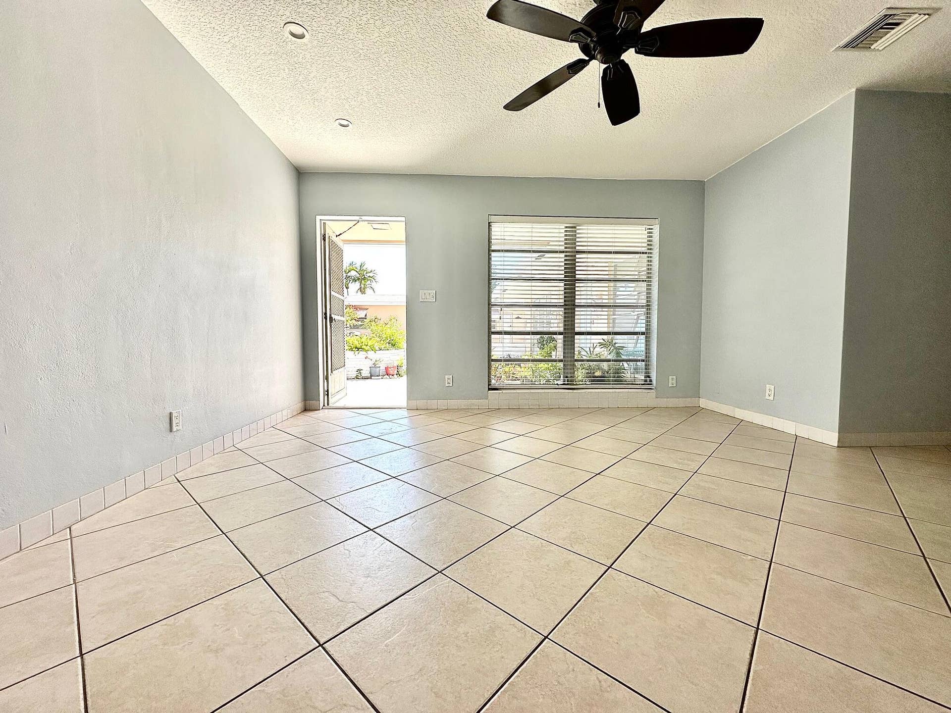 Ceramic tile flooring throughout