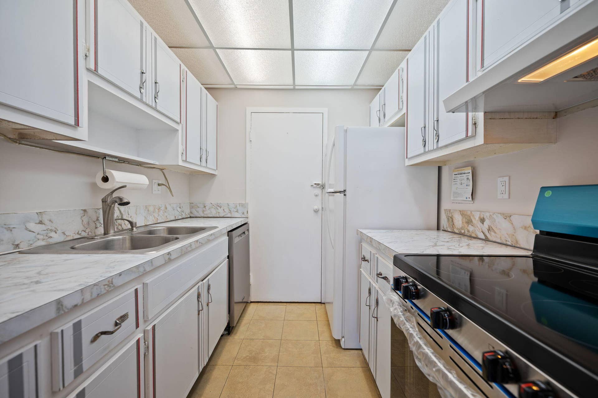Units PH 1406 & PH 1407 are being sold together for $565,000. Unit 1406 kitchen.