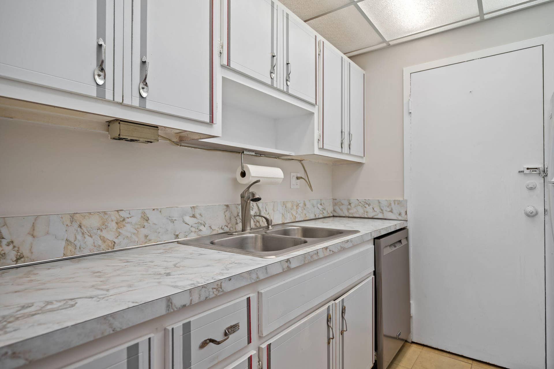 Units PH 1406 & PH 1407 are being sold together for $565,000. Unit 1406 kitchen.