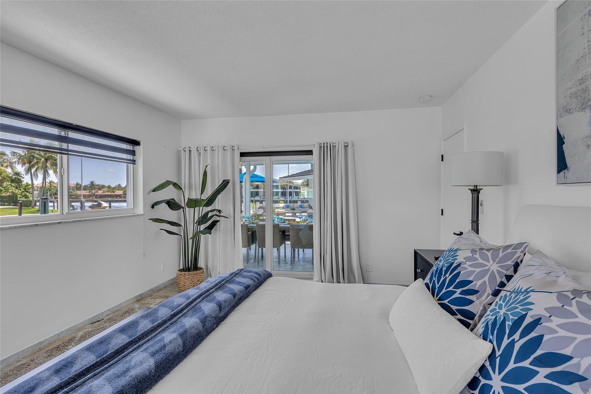 Primary bedroom 1 with sliding glass doors to patio and pool