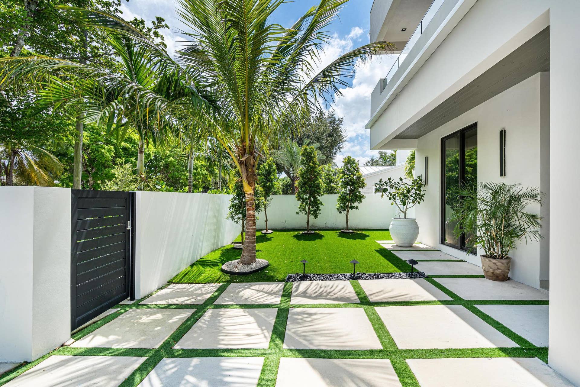 Meticulously manicured landscaping enhances the propertys refined exterior throughout.
