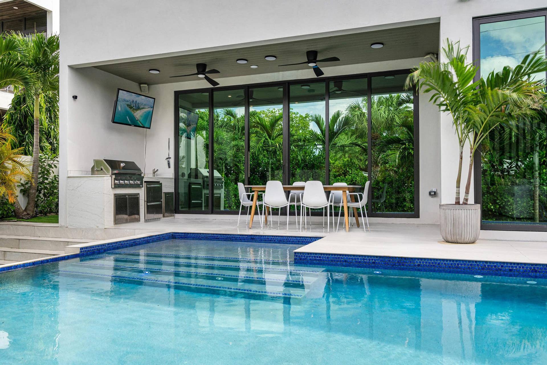 Resort-style backyard with infinity pool, spa and summer kitchen.