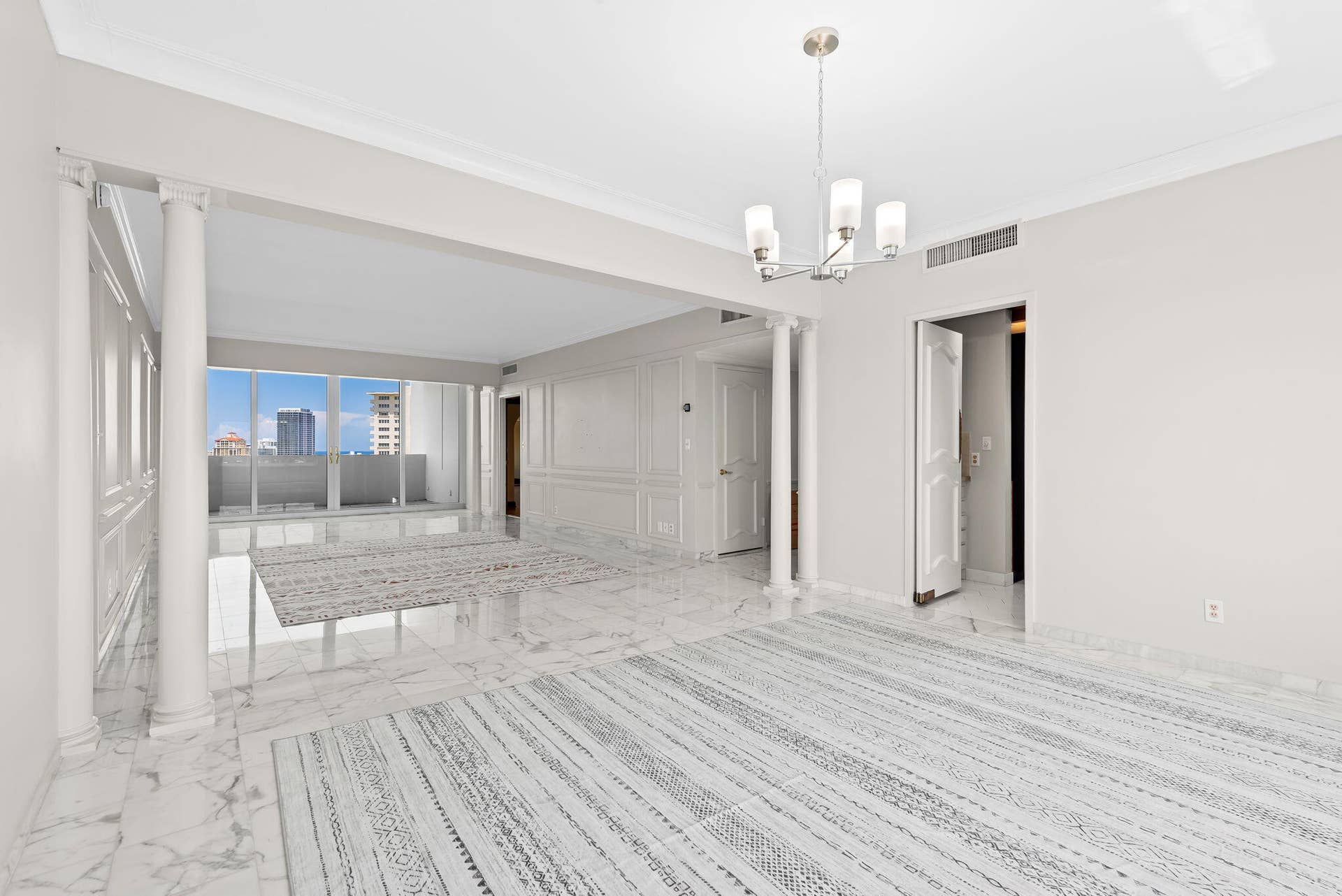 View from dining room to living room and open balcony