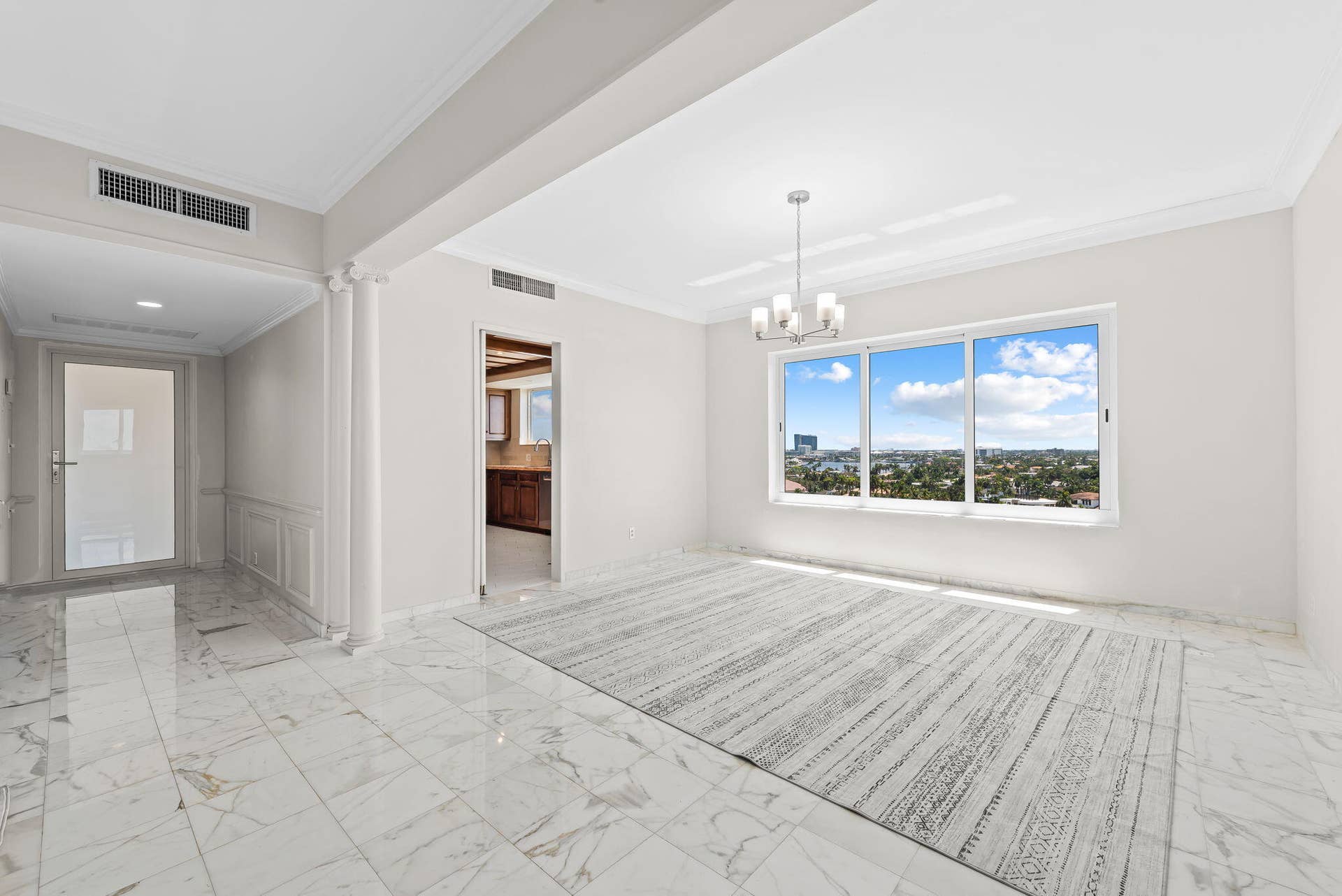 Entrance to apartment leading to open plan dining/livingroom