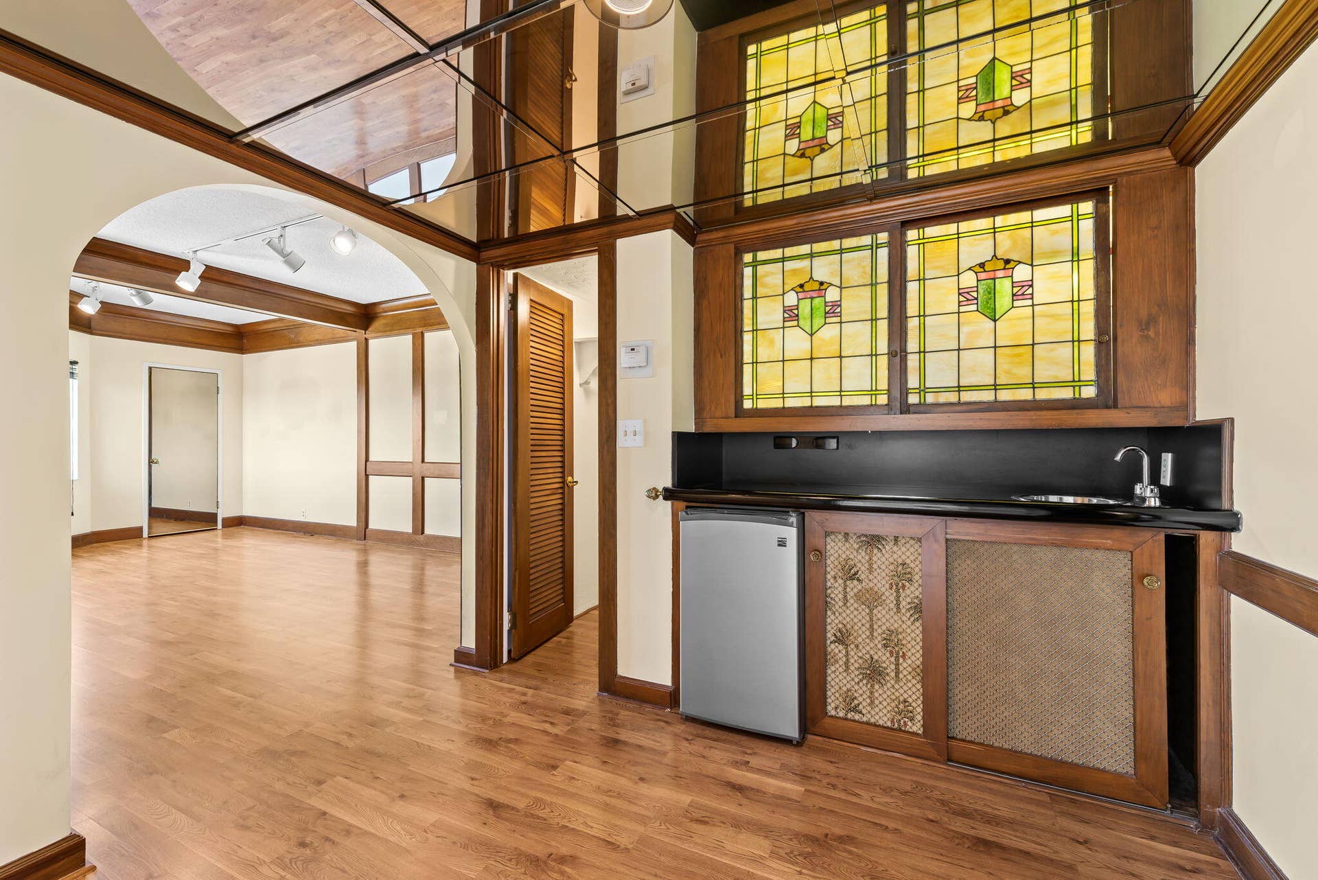Second master suite with built in bar and library shelves