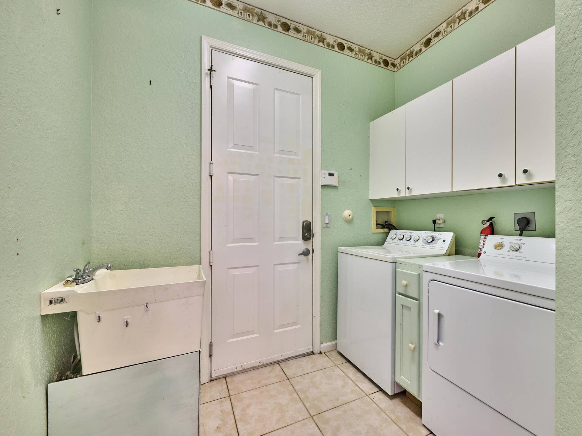 2649 Clipper Circle, West Palm Beach, FL 33411 Sink, storage, washer and dryer. Garage Access