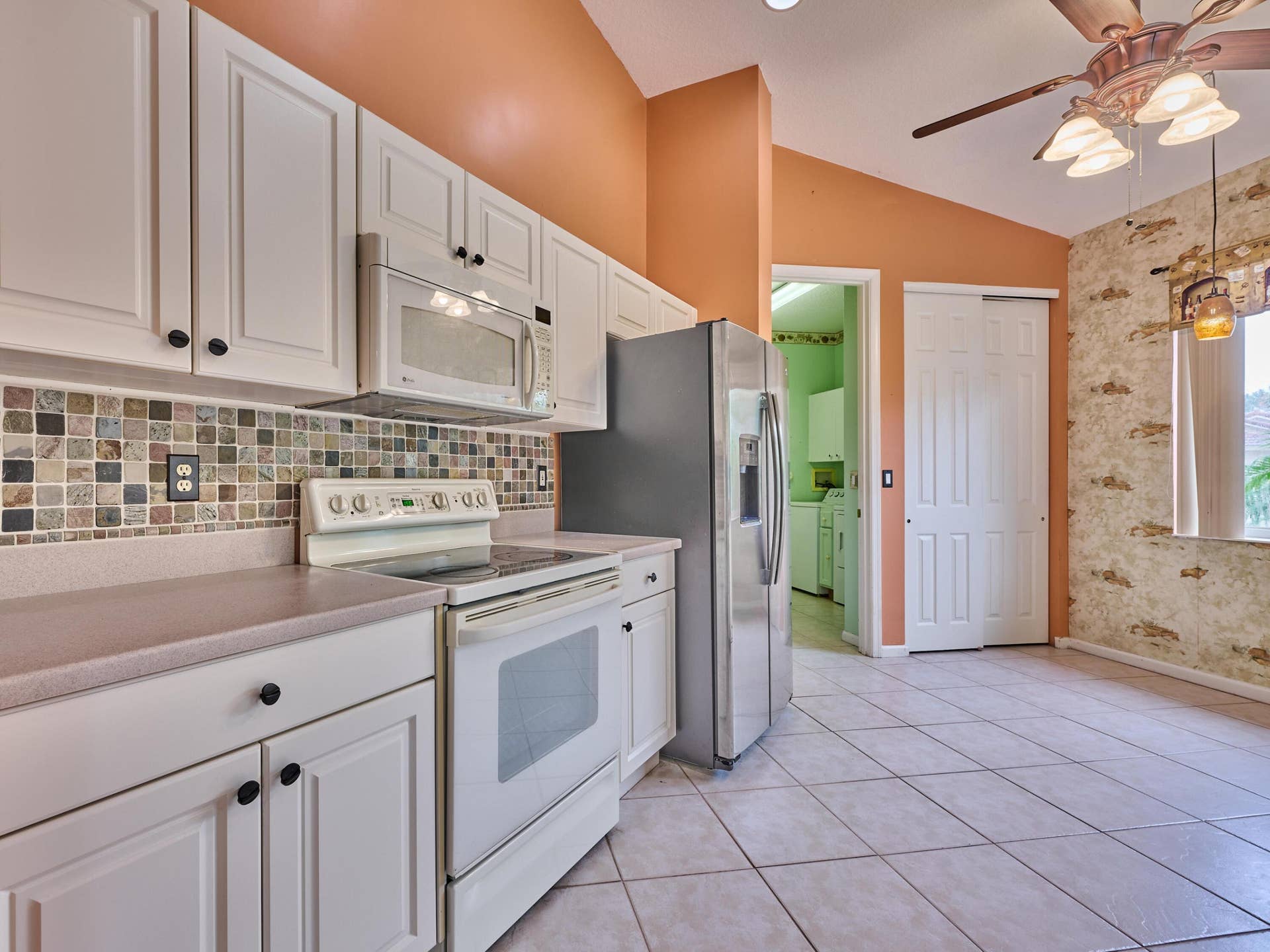 2649 Clipper Circle, West Palm Beach, FL 33411 Corion counters, tiled backsplash, white cabinets