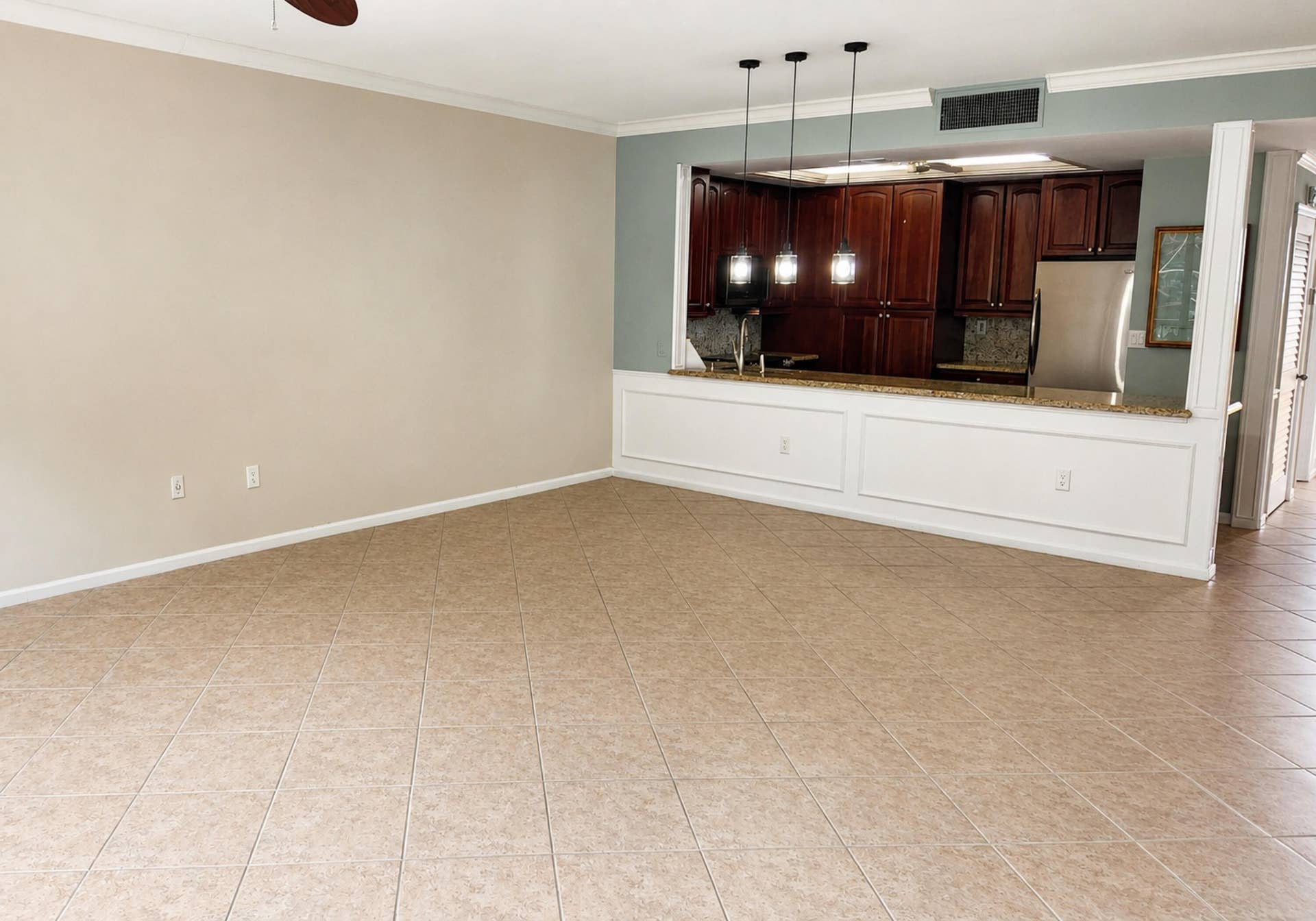 70 Celestial Way, #108, Juno Beach, FL 33408 living area looking back at kitchen