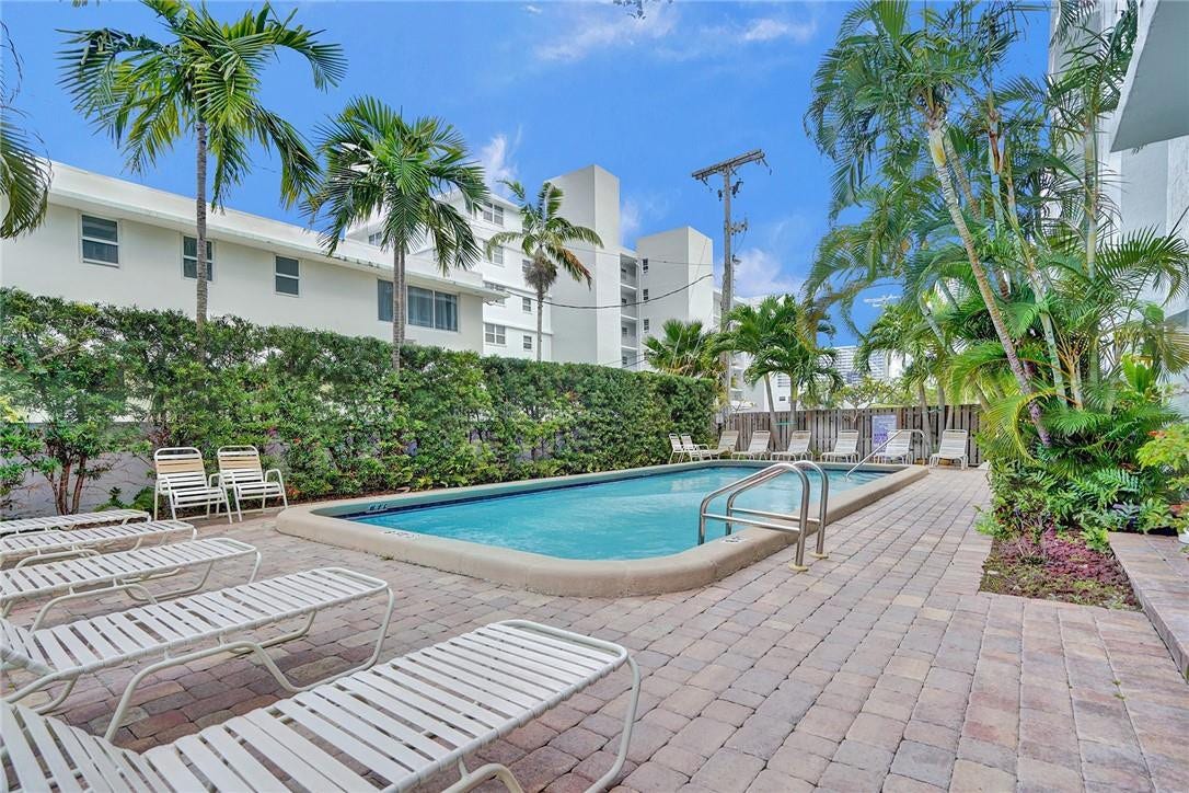 Community Pool in Tropical Setting of Leisure Sands