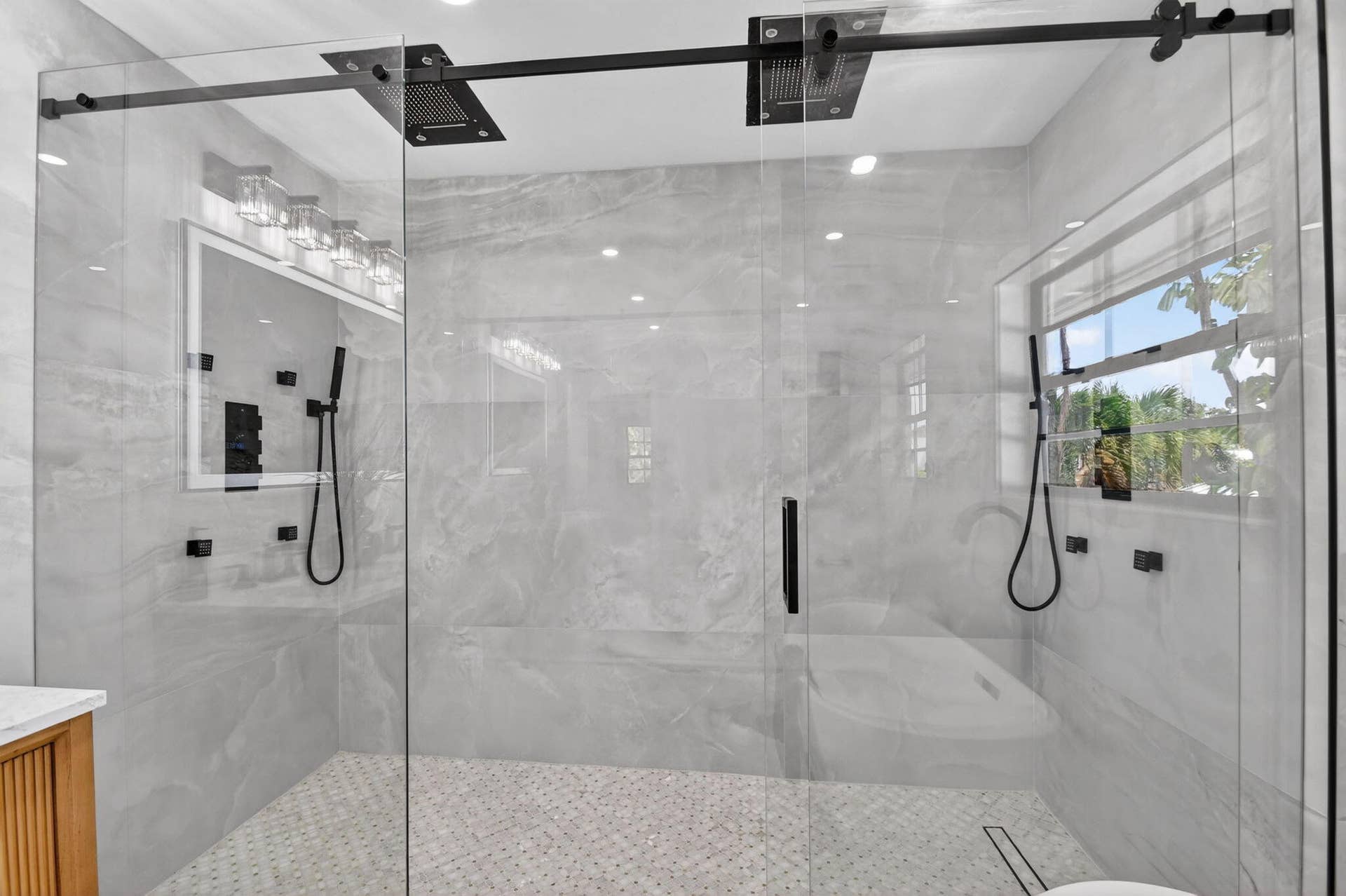 308 Greymon Drive, West Palm Beach, FL 33405 Features dual rainfall shower heads and multiple shower sprays