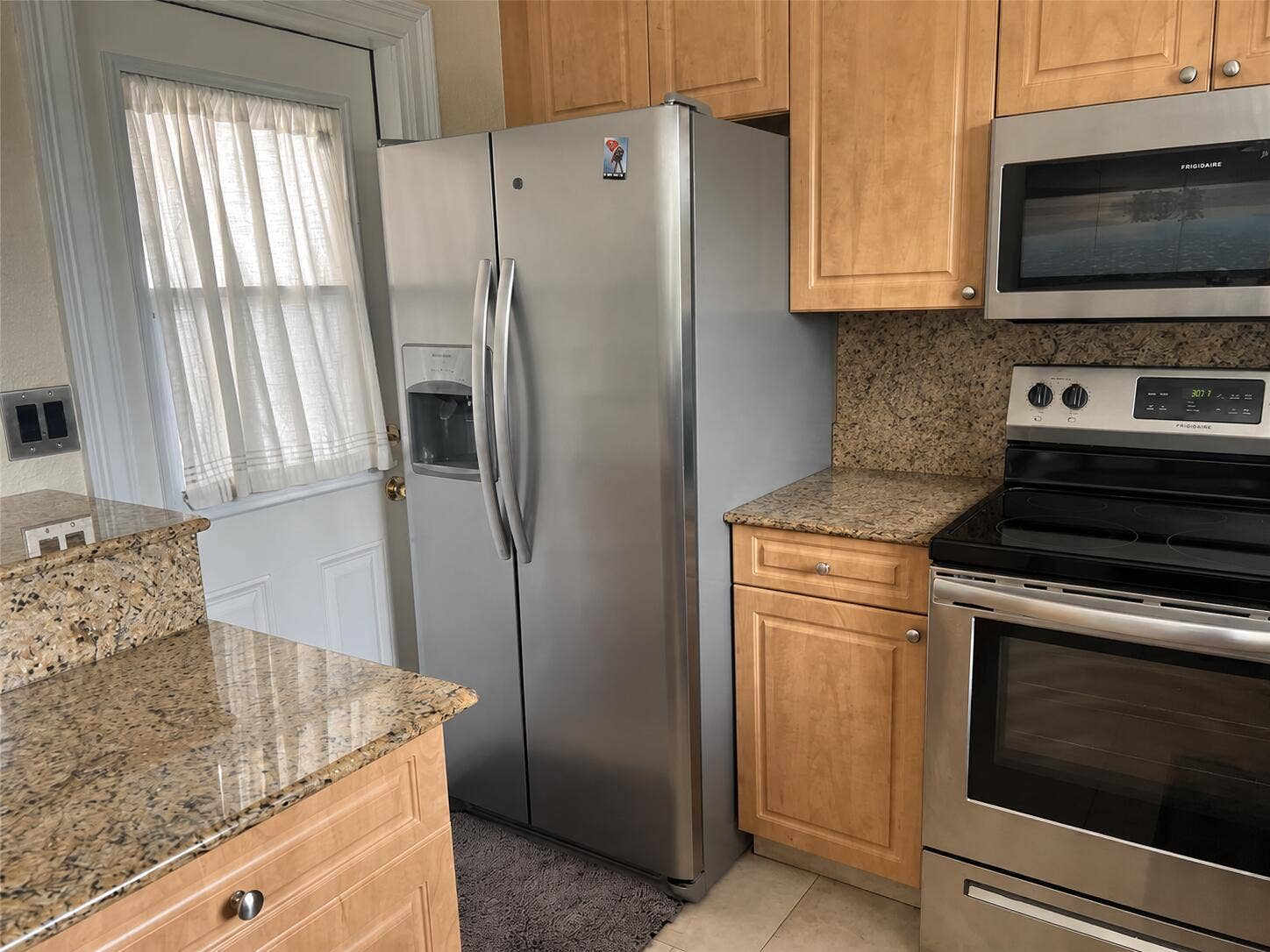One door leads to the kitchen.
