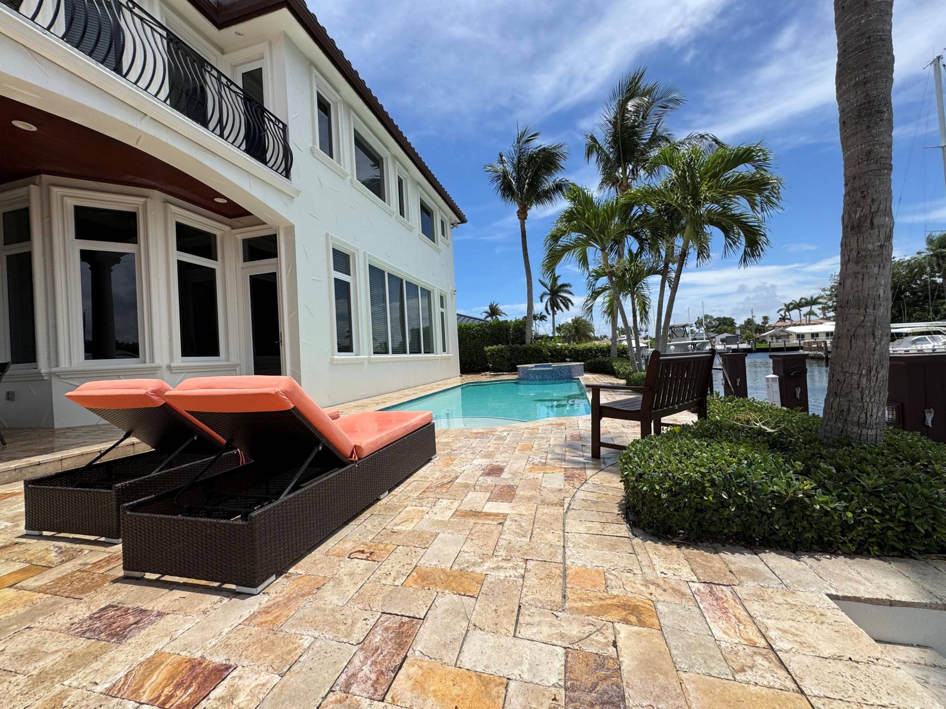 4431 NE 24th Avenue, Lighthouse Point, FL 33064 Back of the house with lounge and pool