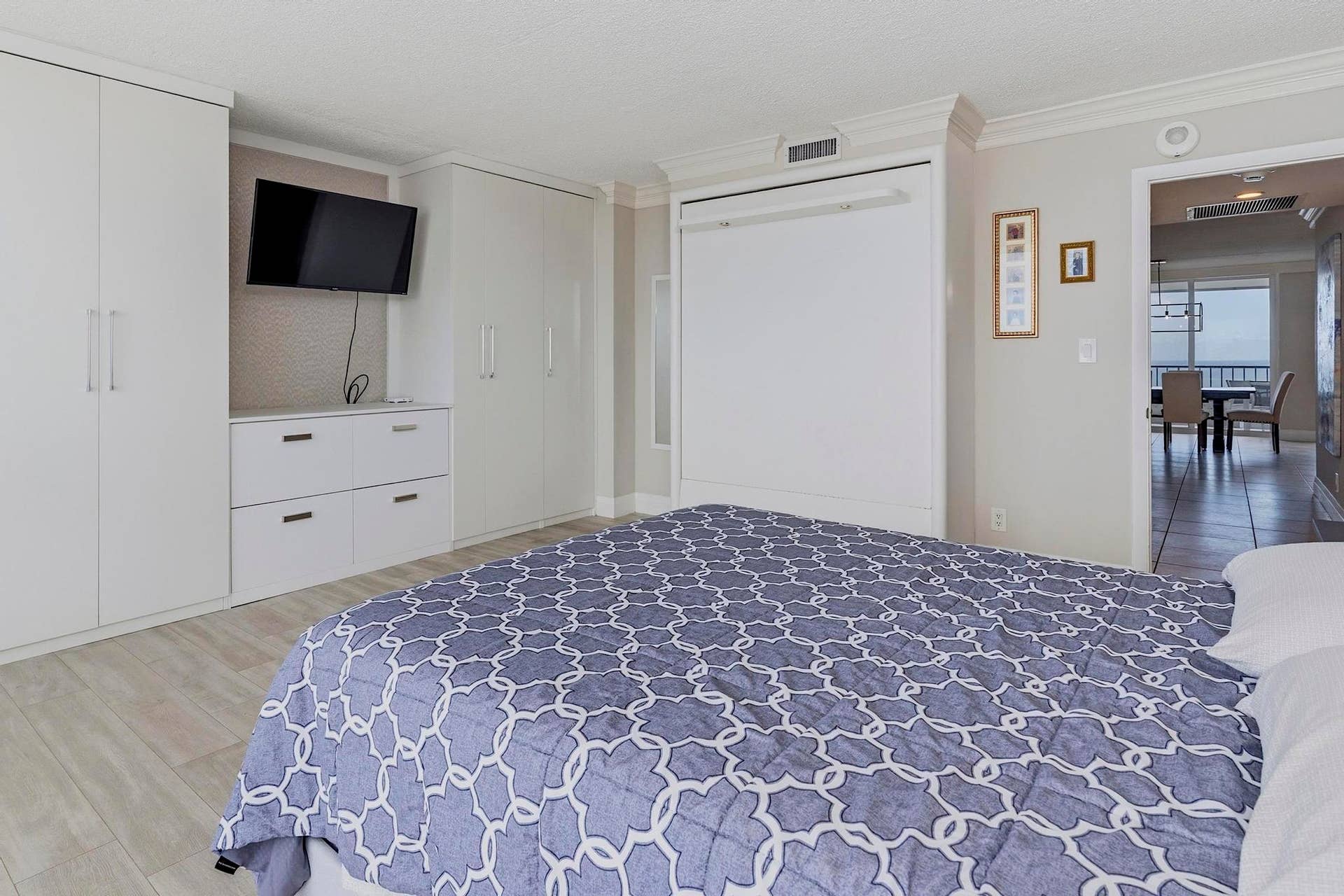Guest Bedroom with Custom Built in Cabinetry & Murphybed