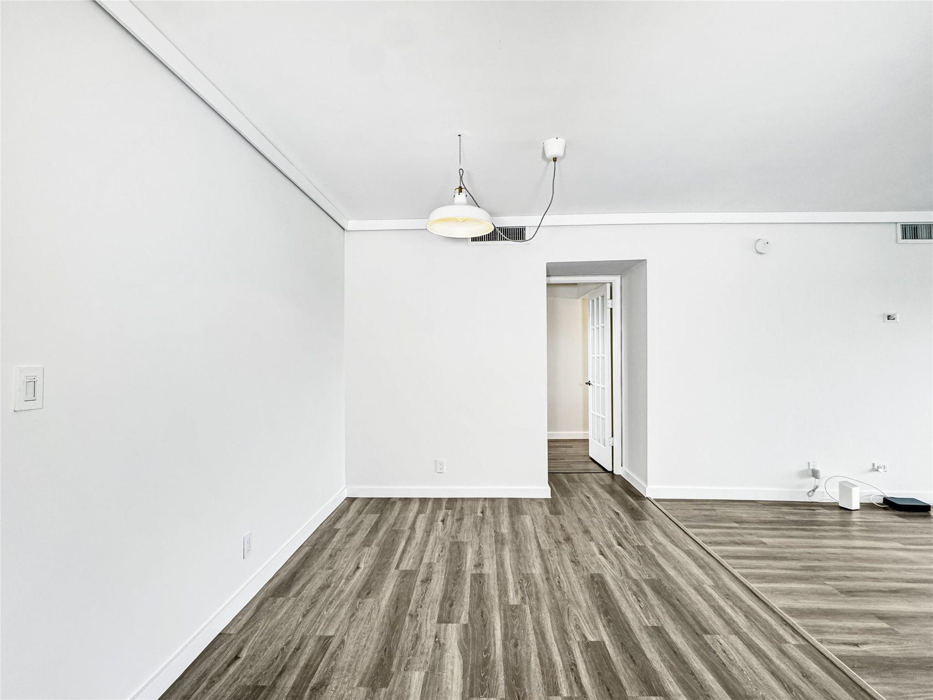 2950 N Palm Aire Drive, #506, Pompano Beach, FL 33069 Dining area features an open layout with updated vinyl flooring and contemporary lighting. The spacious design flows seamlessly into the main living spaces.