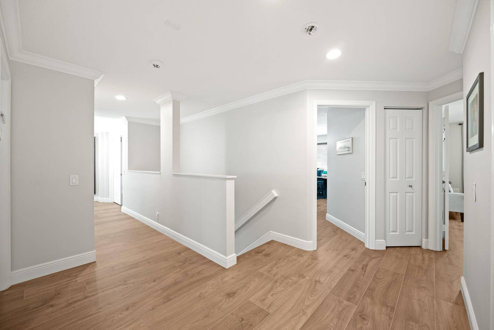 Spacious landing area on 2nd floor. The same neutral, water resistant HDF flooring on staircase and all of 2nd floor (except the bathrooms)