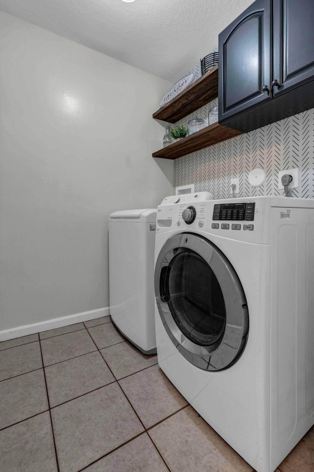 22925 Sterling Lakes Drive, Boca Raton, FL 33433 Laundry Room. Outlet and alarm box removed from photo.